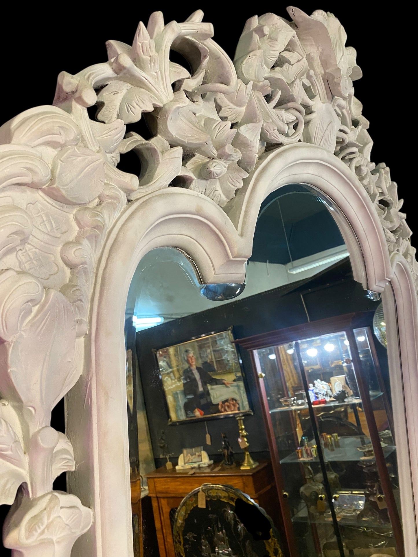 Very large carved wooden framed bevelled edge mirror