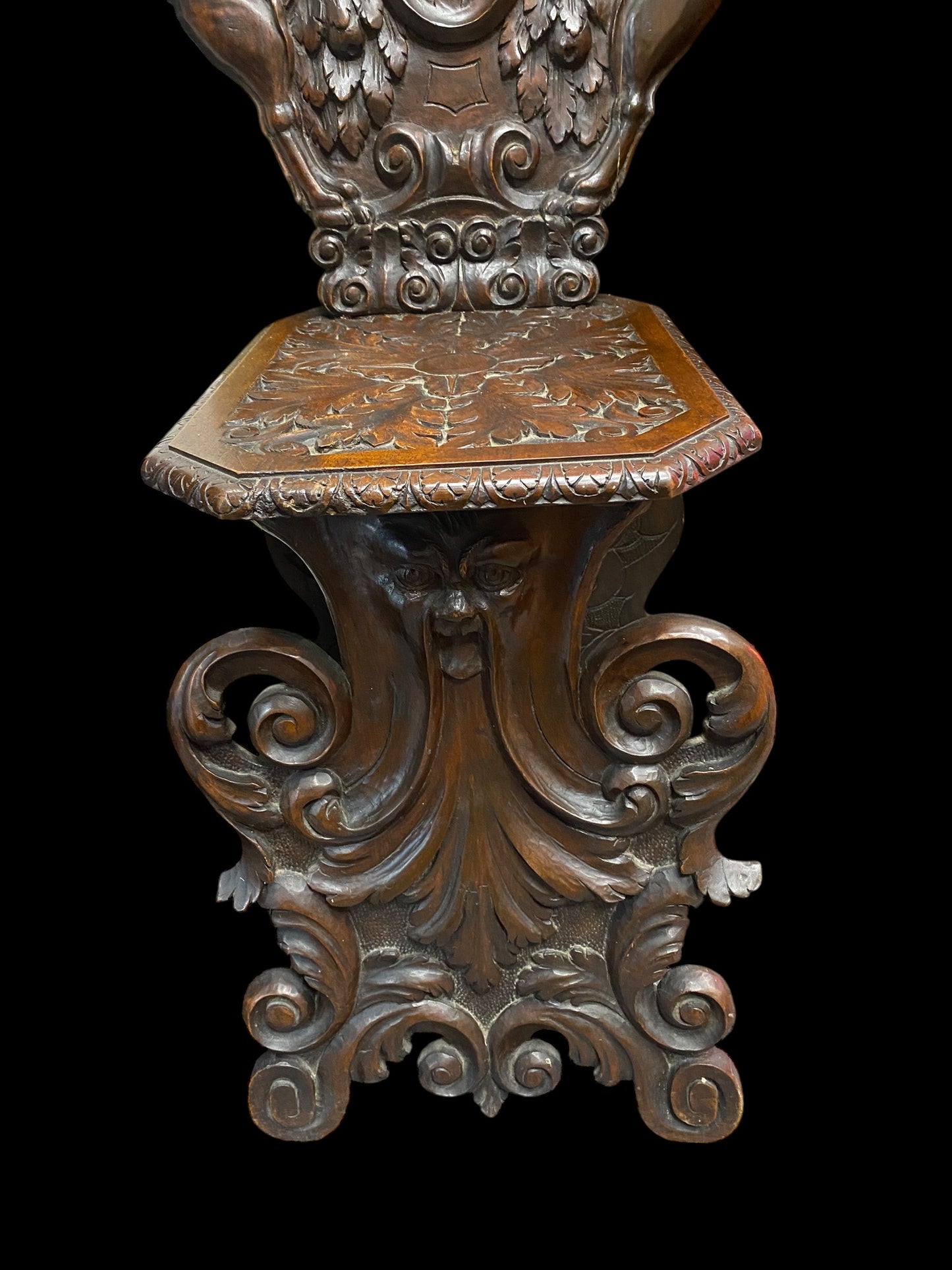 A Neo Renaissance Sgabello walnut chair, likely crafted around the 1800s