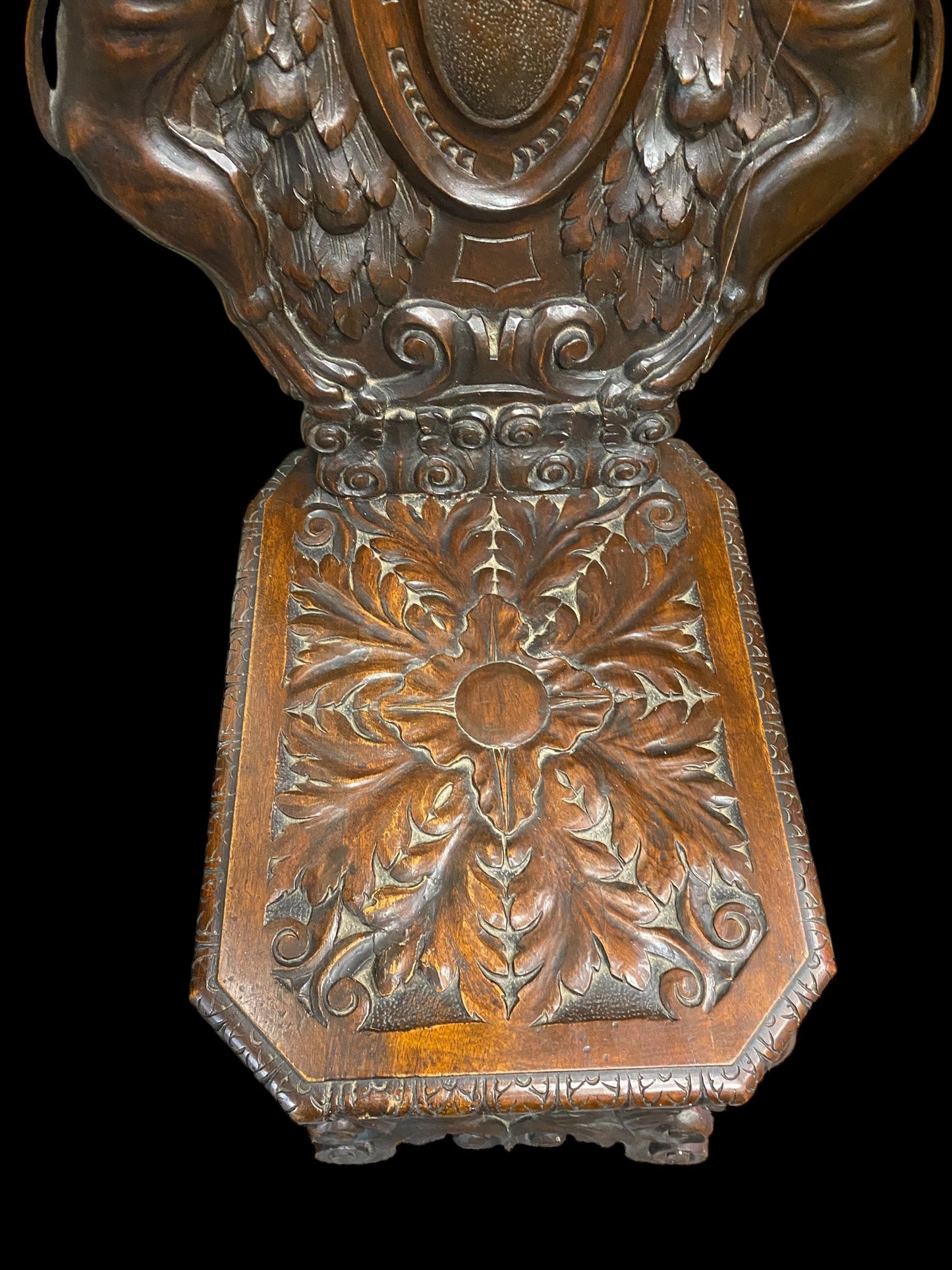 A Neo Renaissance Sgabello walnut chair, likely crafted around the 1800s