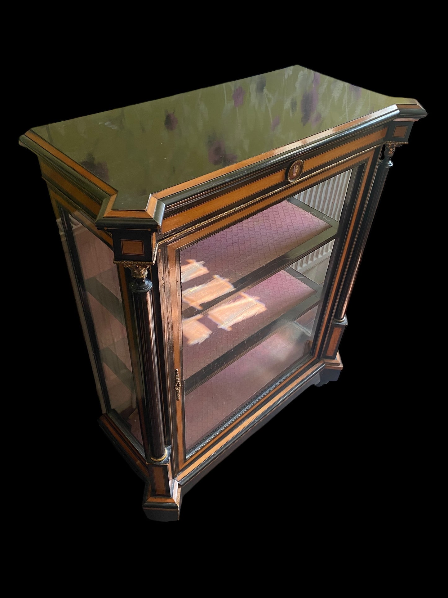 A Victorian ebonised and walnut cross-banded vitrine