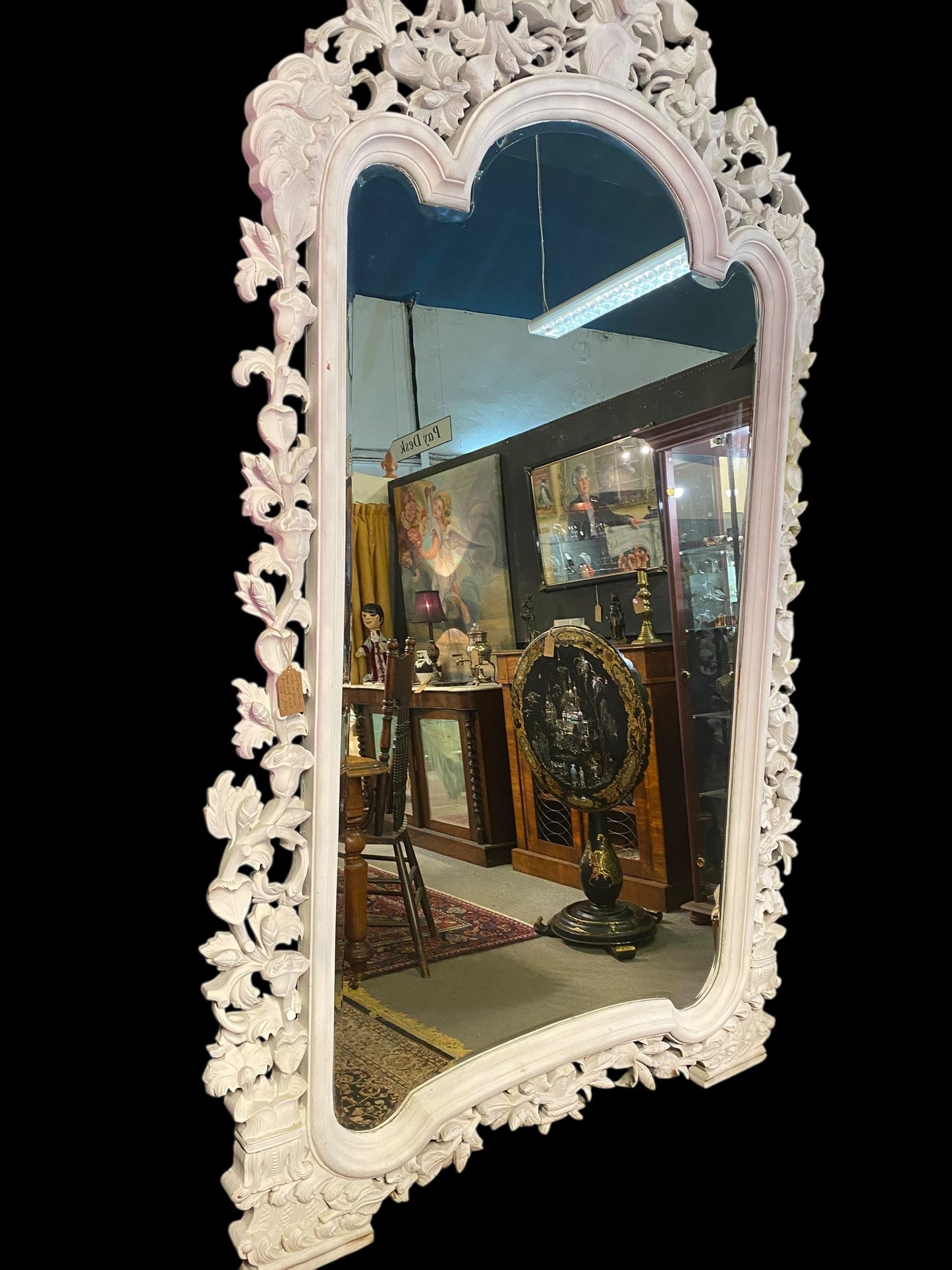 Very large carved wooden framed bevelled edge mirror