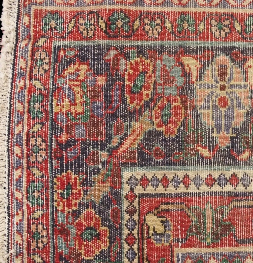 A black floral foliate patterned ground Lilihan rug