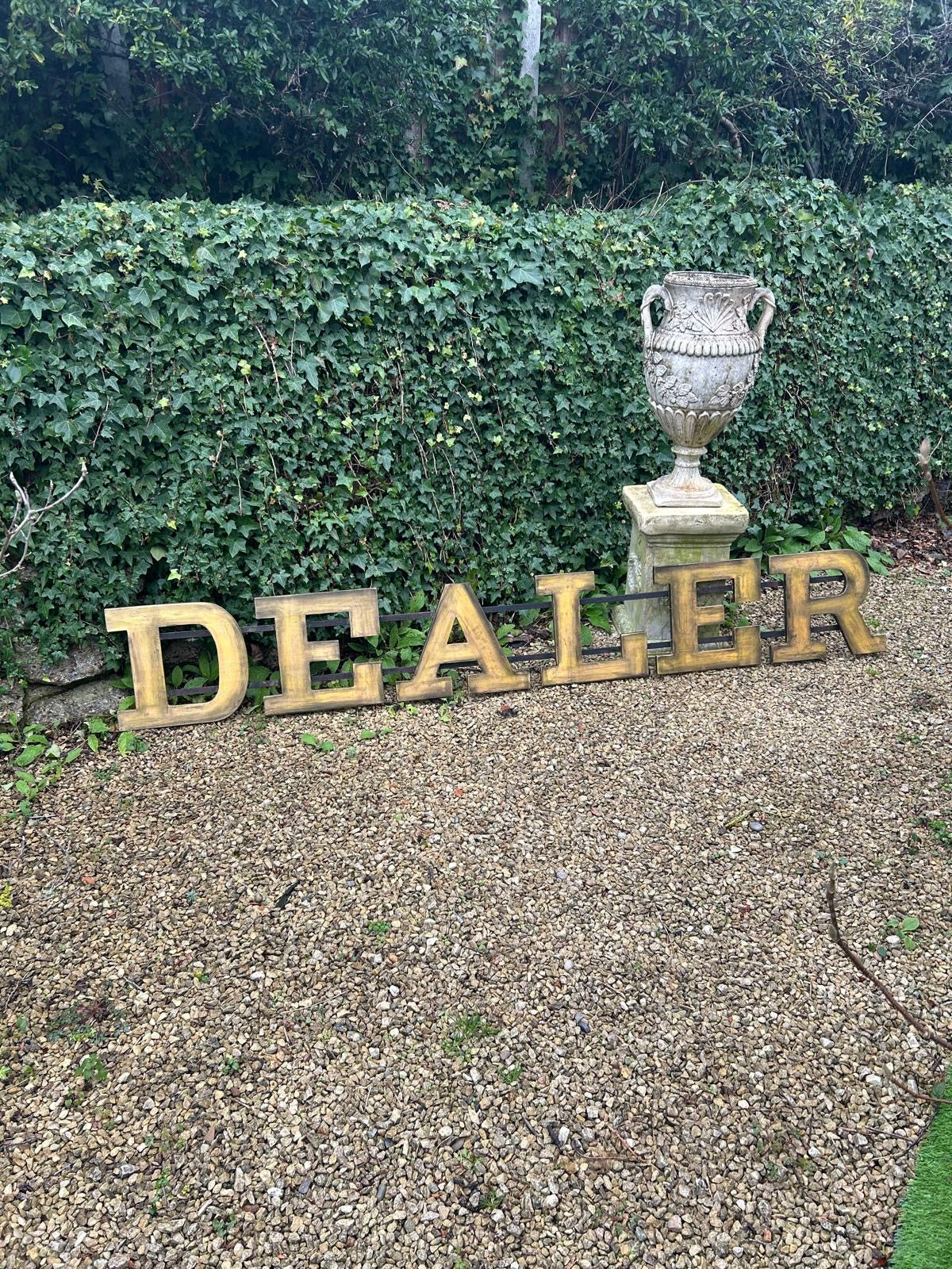 Large former shopfront DEALER sign