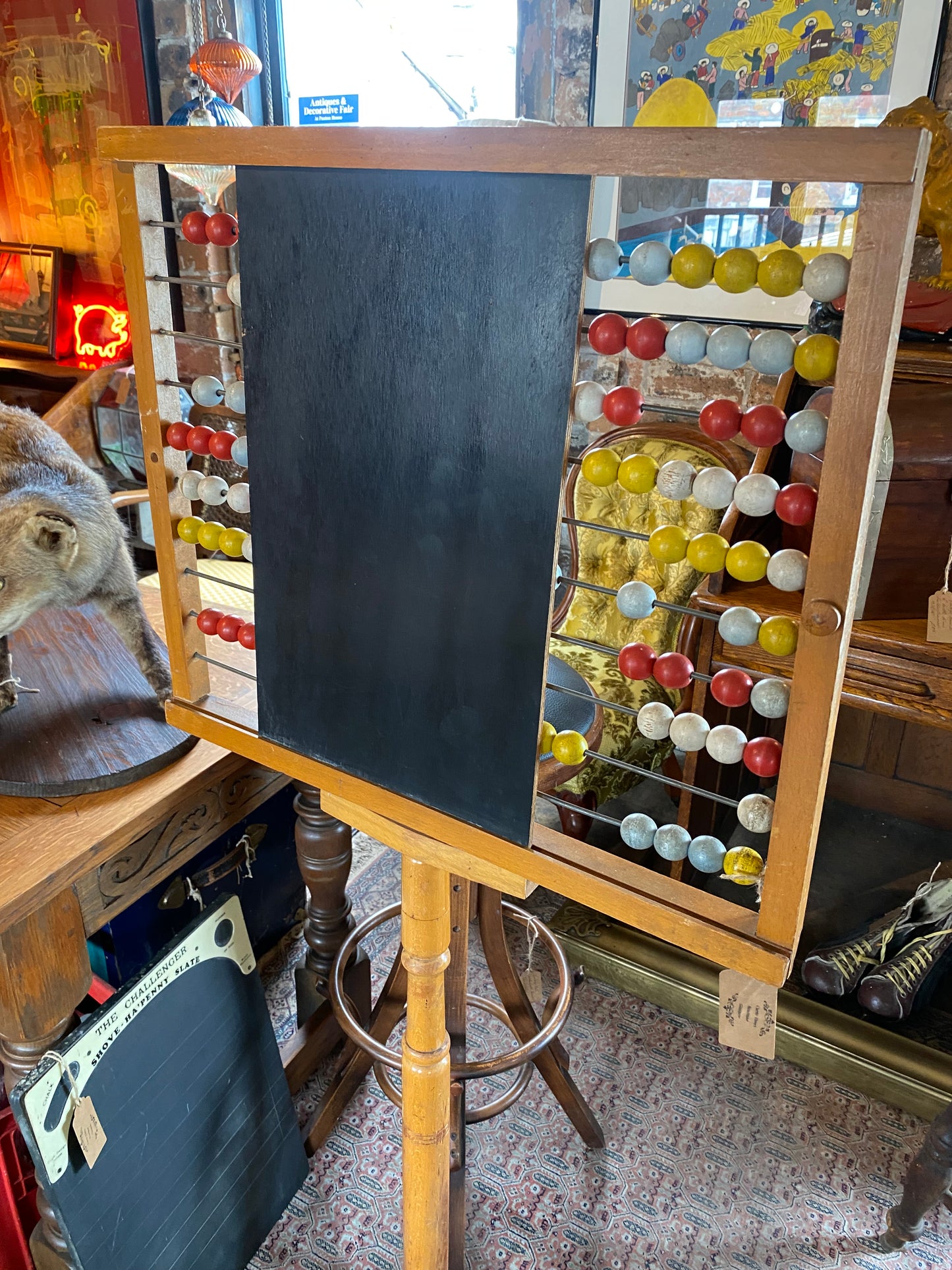 Mid-century freestanding pine abacus with chalk board on cast iron base