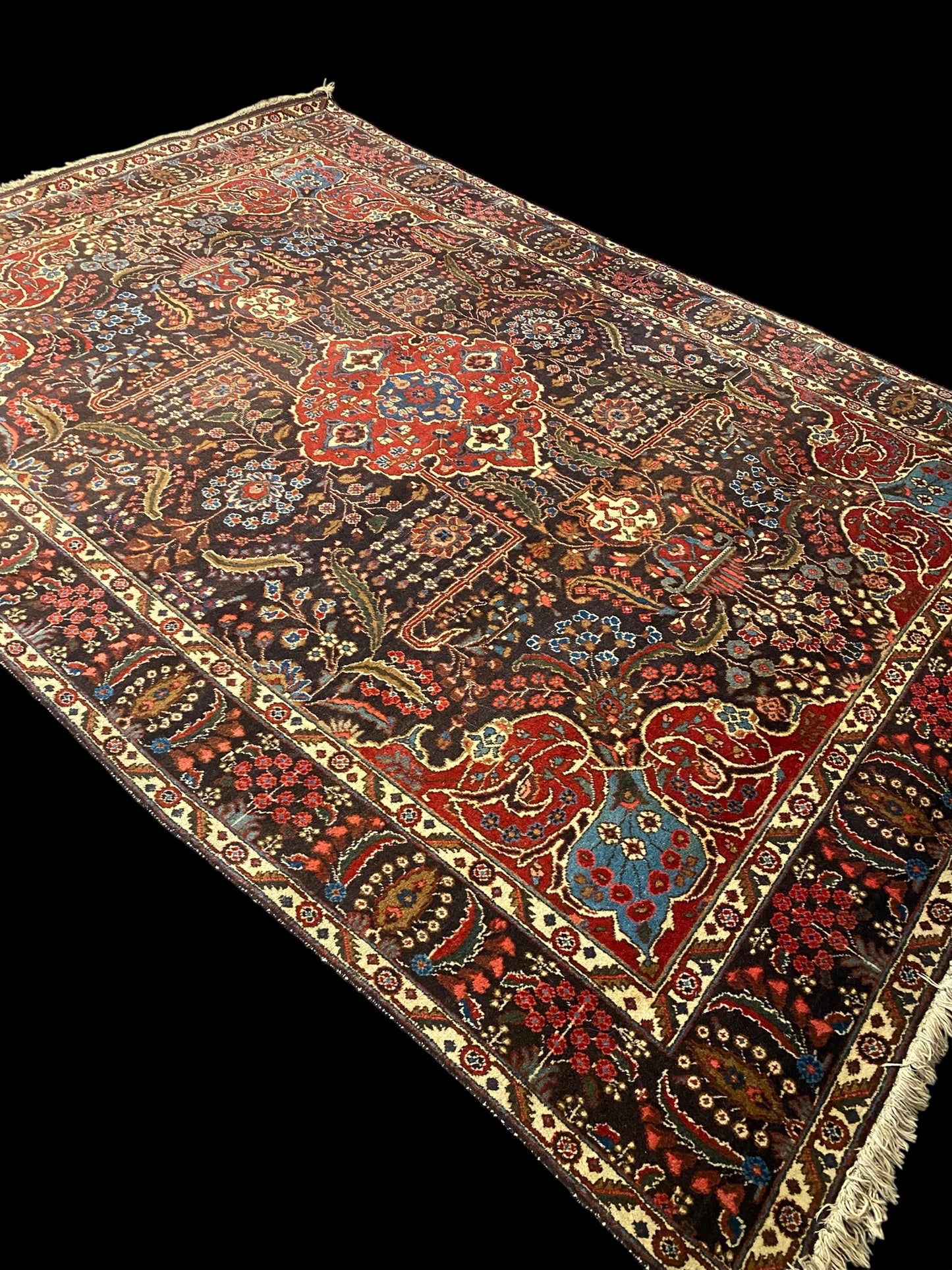 Antique Persian hand tied wool carpet on red and blue ground