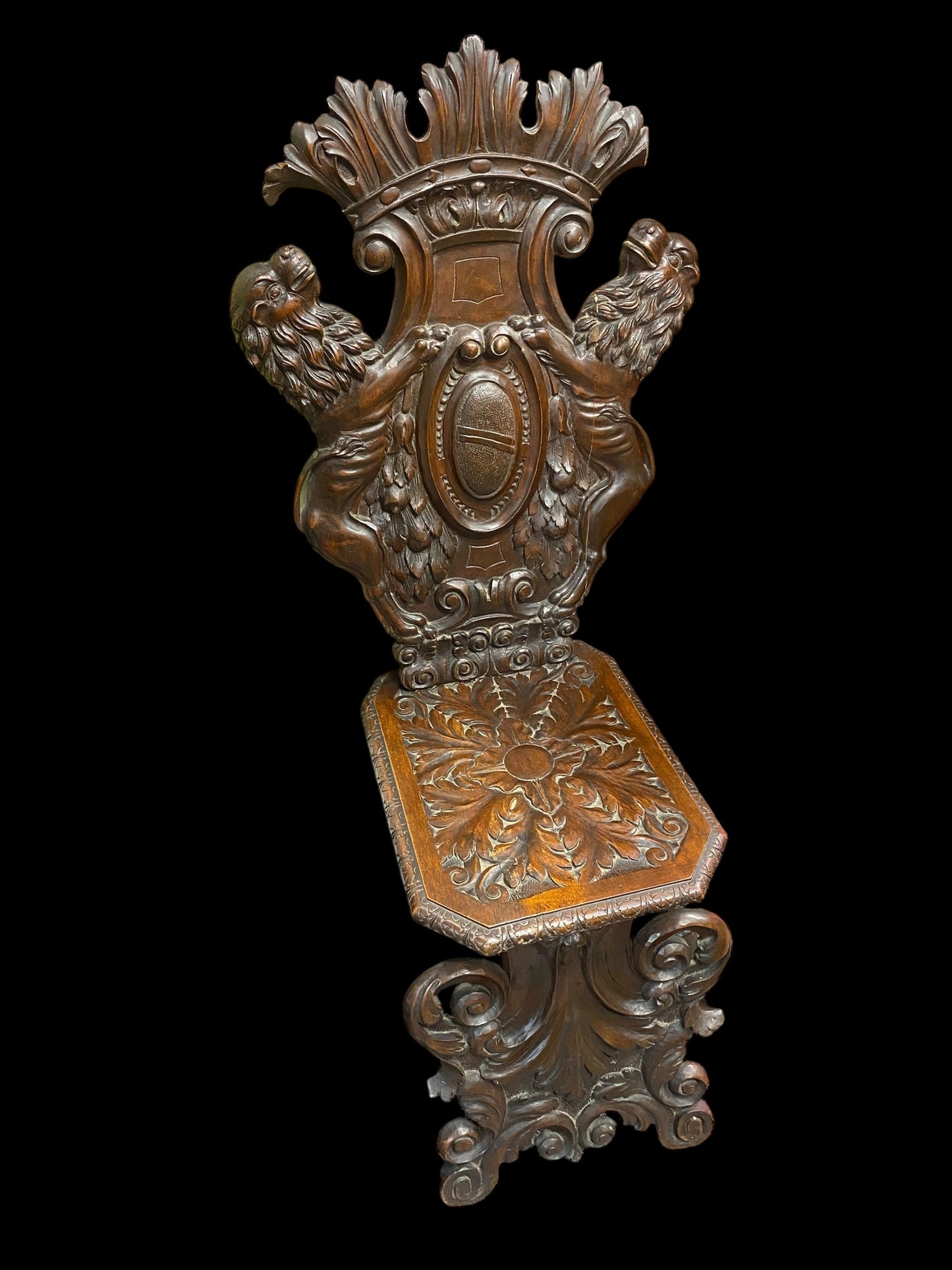 A Neo Renaissance Sgabello walnut chair, likely crafted around the 1800s