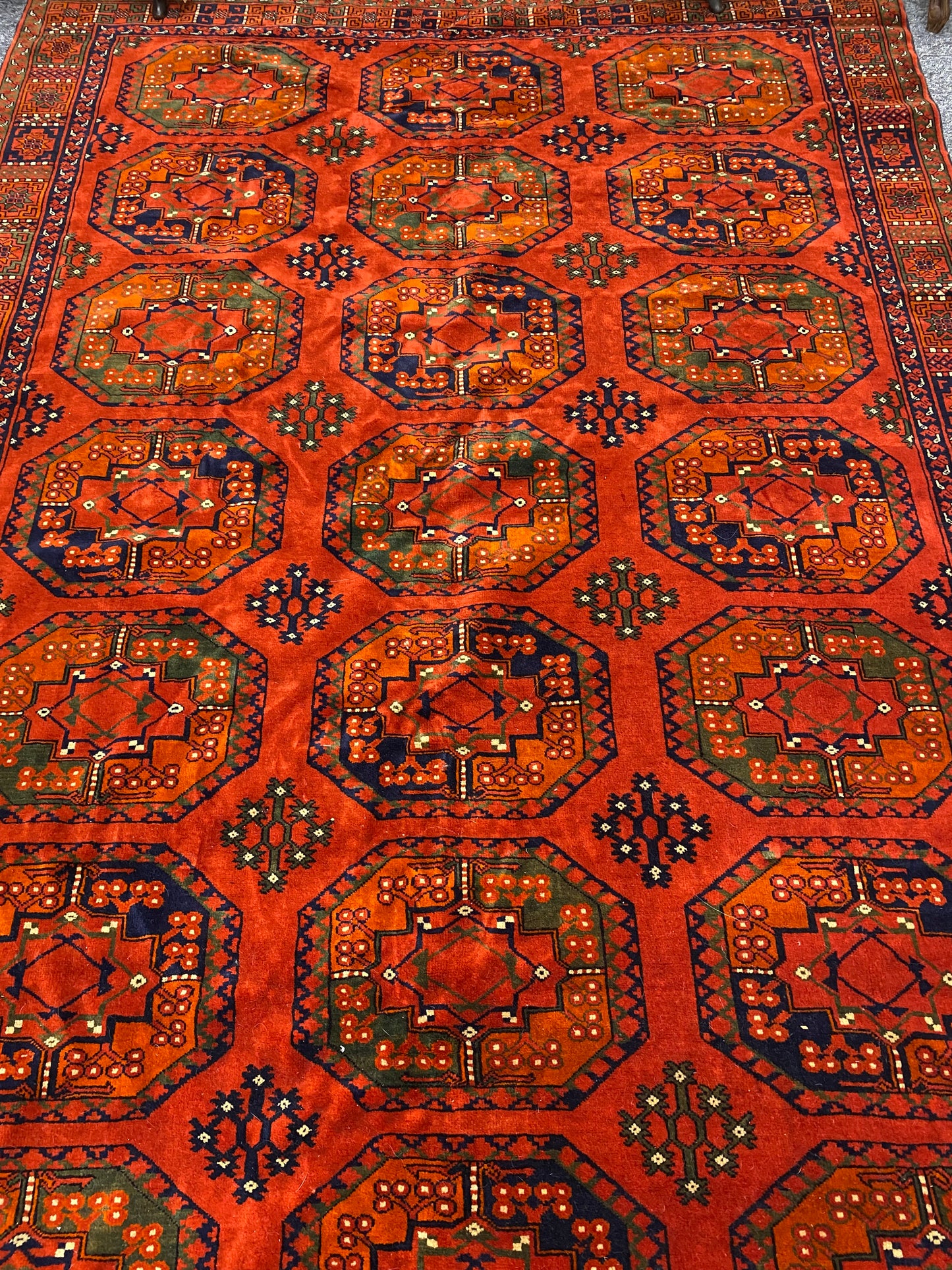 A stunning Turkoman Kerki rug with motif decoration on an orange ground, 275 x 165cm (including fringe)