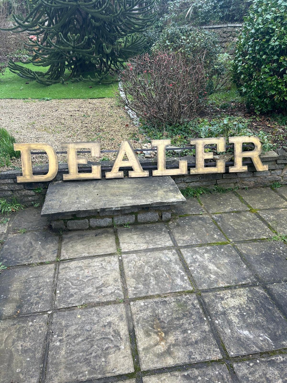 Large former shopfront DEALER sign