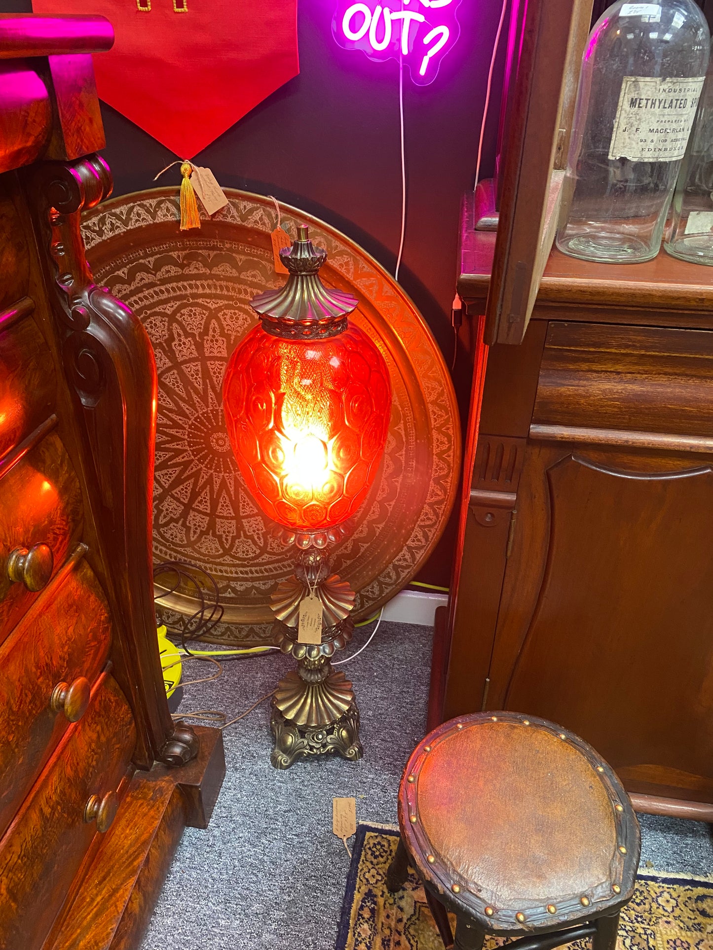 A large 1960’s Carl Falkenstein lamp with a cranberry glass shade