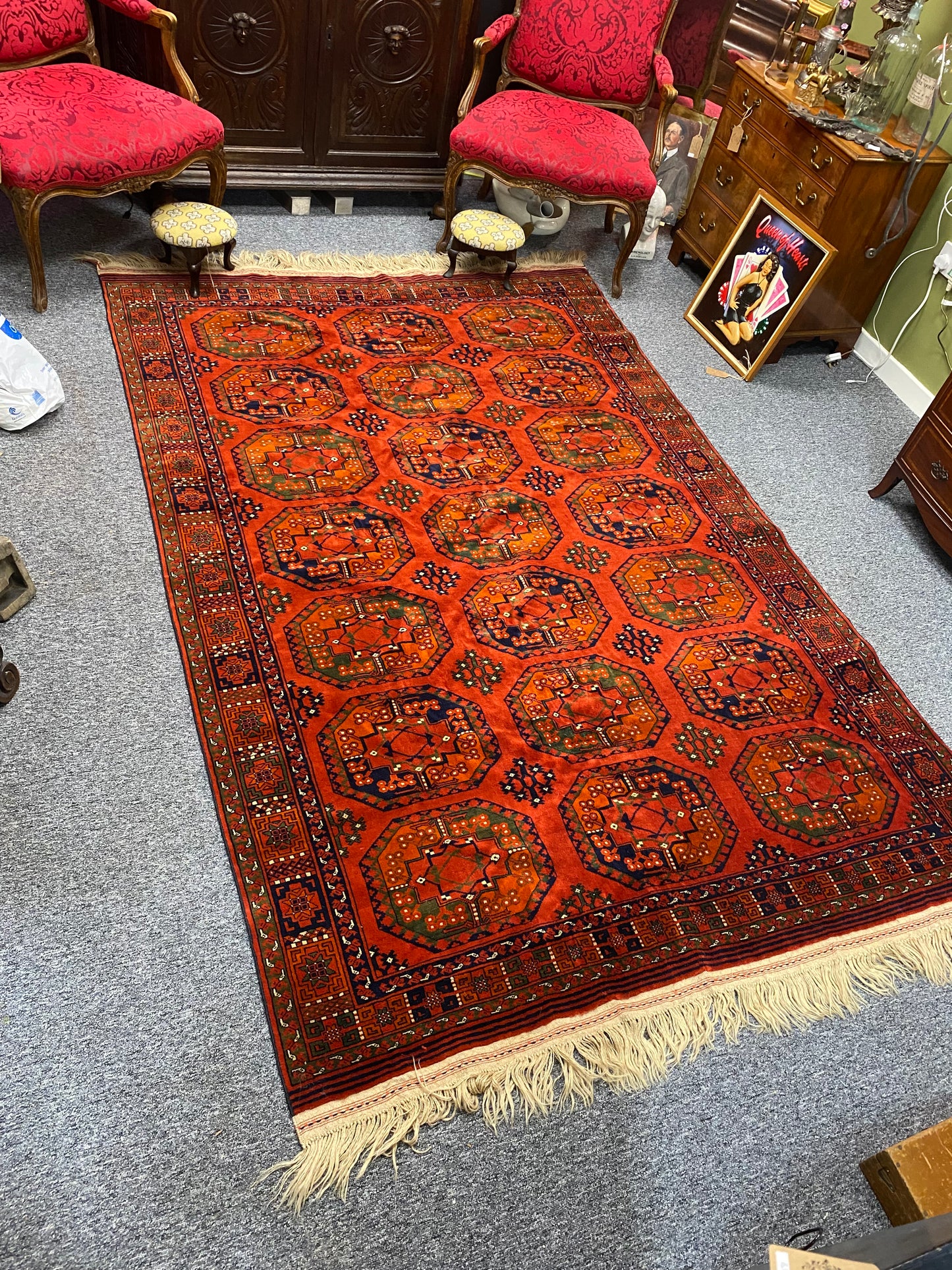 A stunning Turkoman Kerki rug with motif decoration on an orange ground, 275 x 165cm (including fringe)