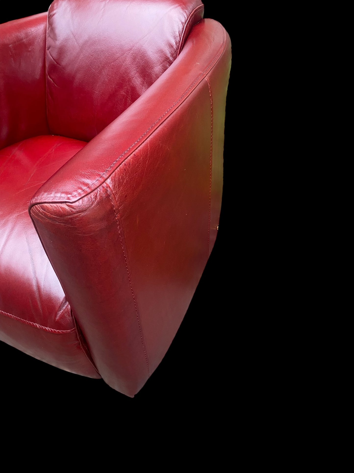 A stunning red leather vintage club chair
