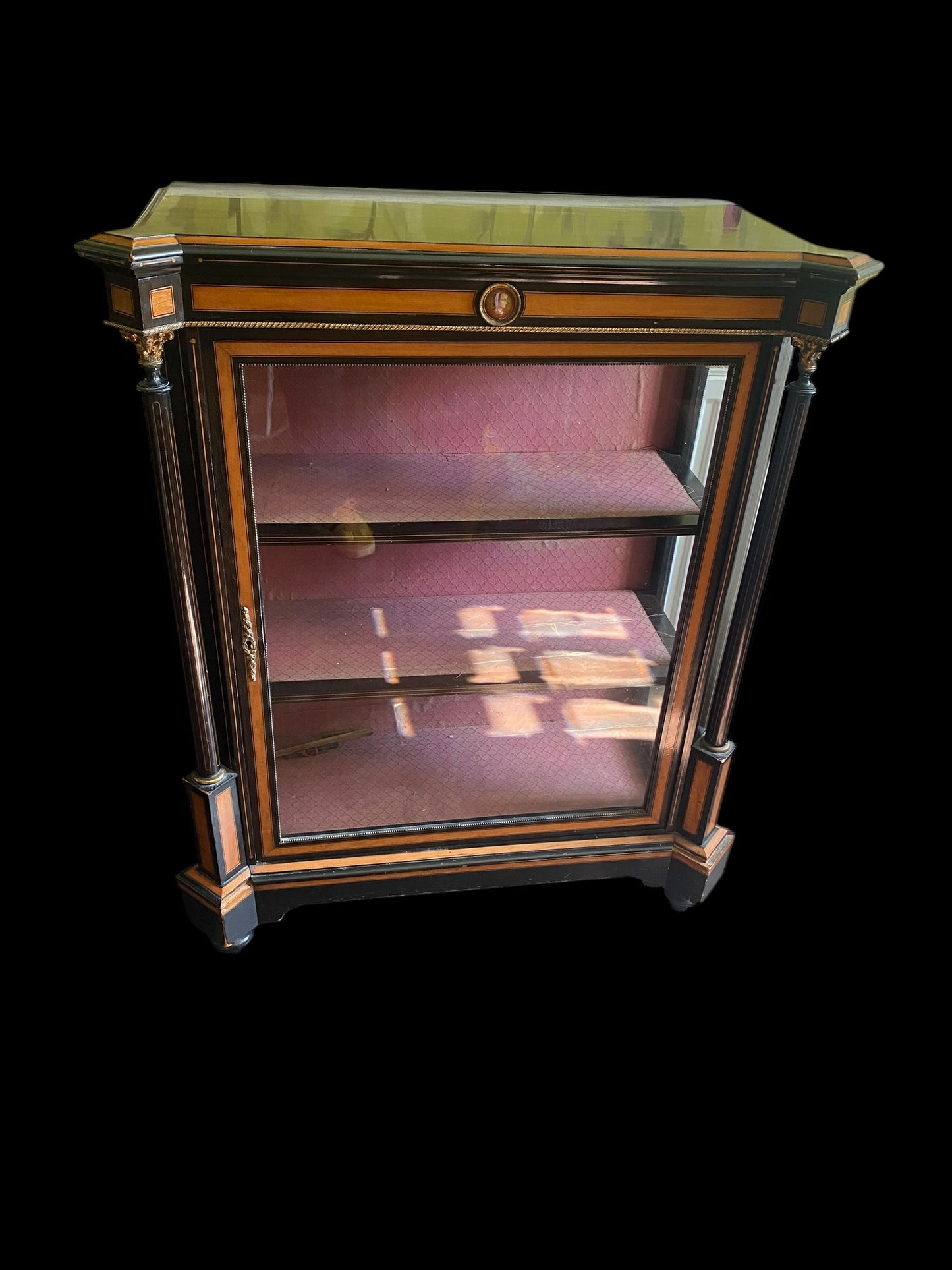 A Victorian ebonised and walnut cross-banded vitrine