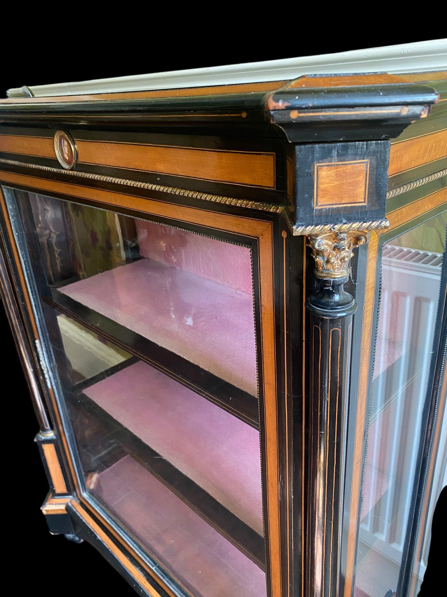 A Victorian ebonised and walnut cross-banded vitrine