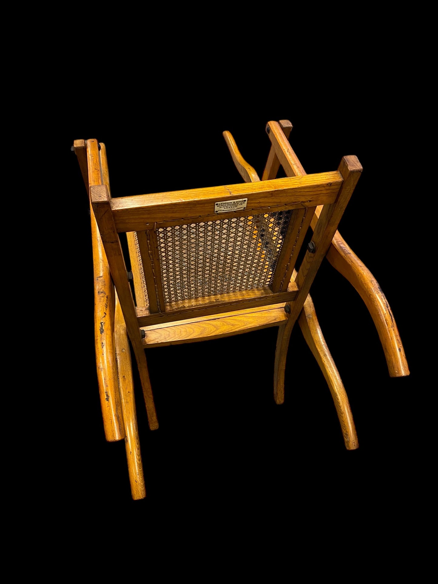 A first World War ash and cane campaign traveling or invalid’s folding armchair
