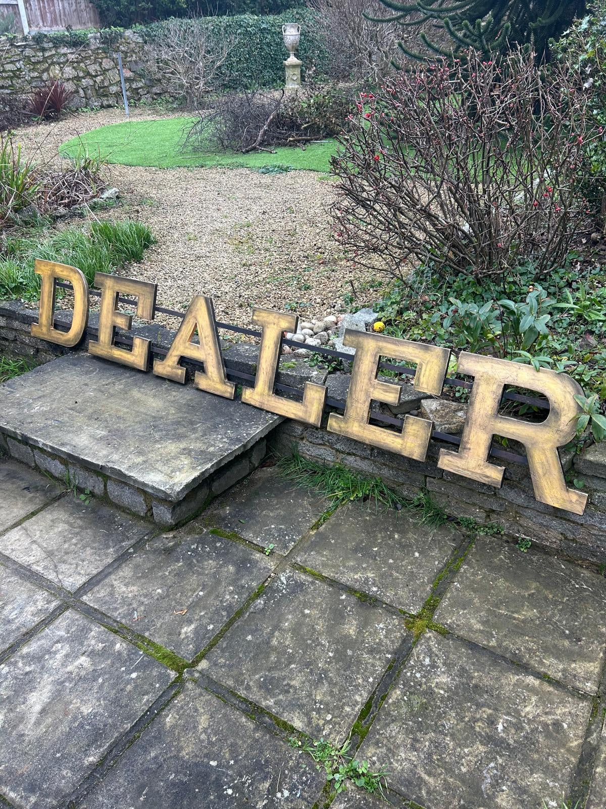 Large former shopfront DEALER sign