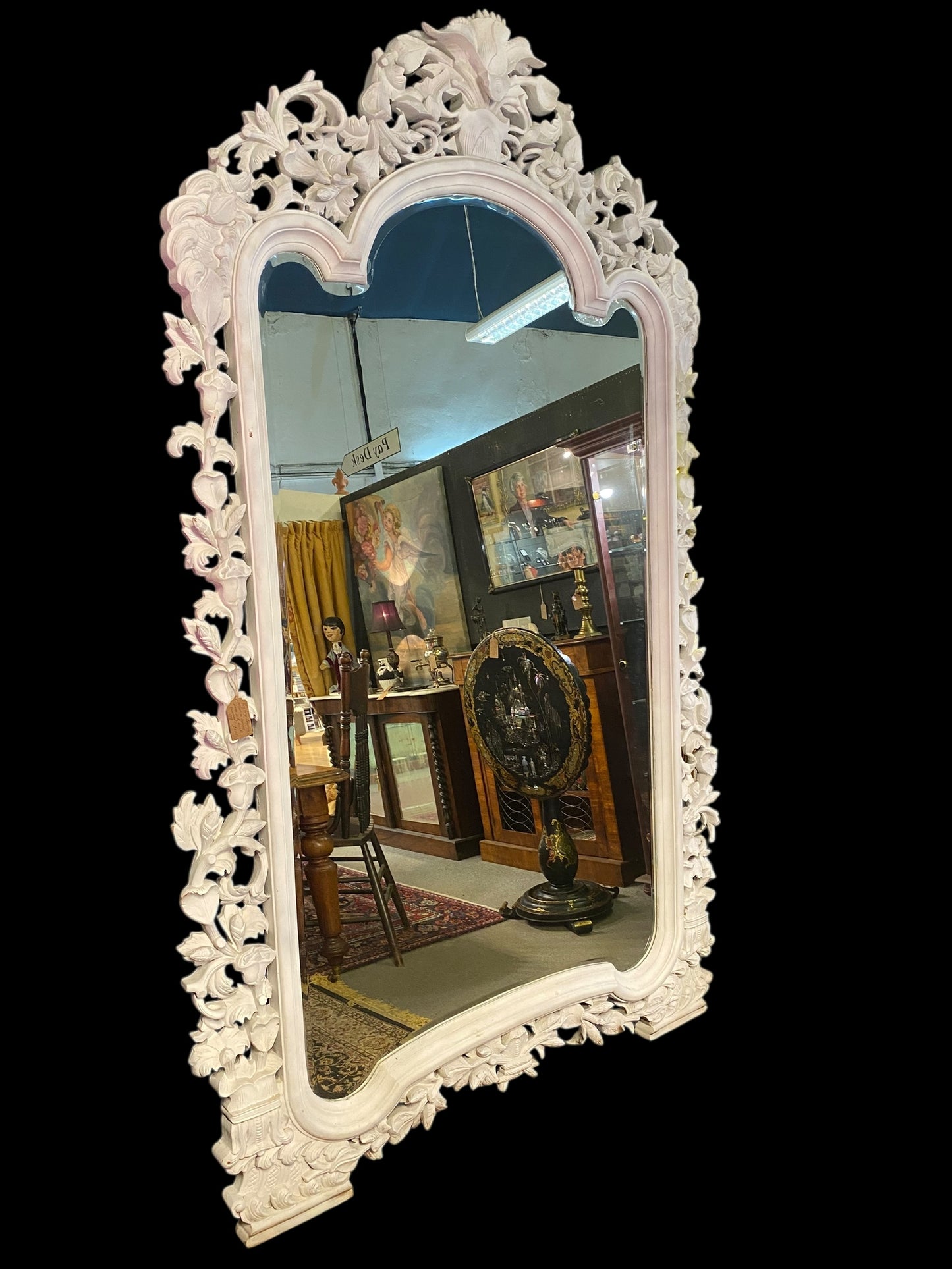 Very large carved wooden framed bevelled edge mirror