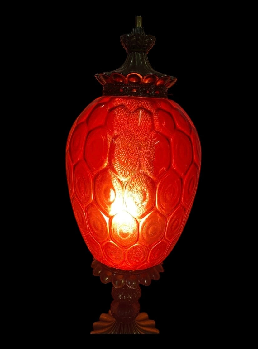 A large 1960’s Carl Falkenstein lamp with a cranberry glass shade