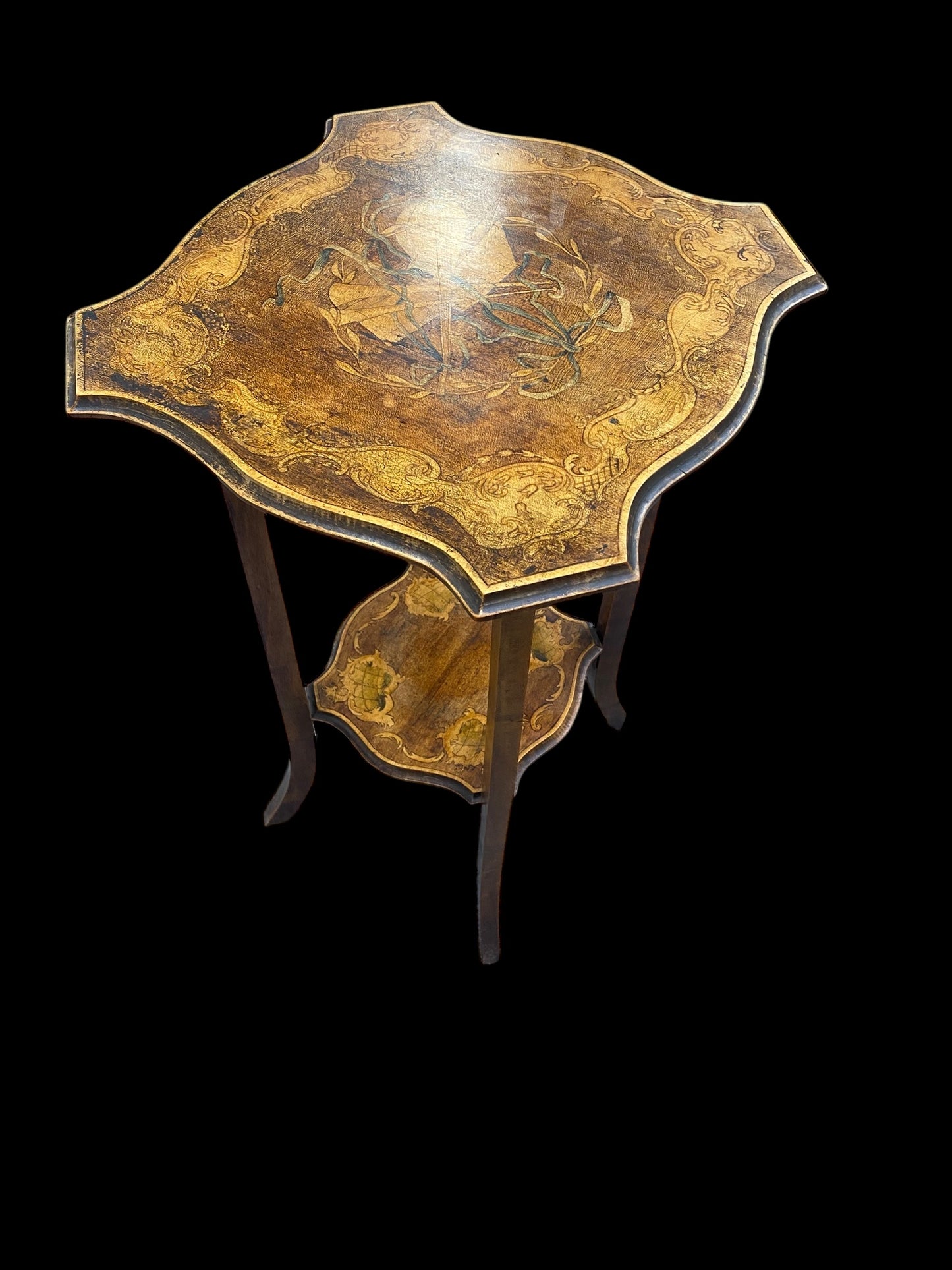 Early 1900's two tier side table painted with Musical instruments, wreath, ribbon and ornate design border