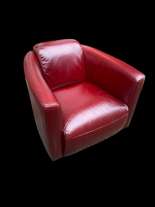 A stunning red leather vintage club chair