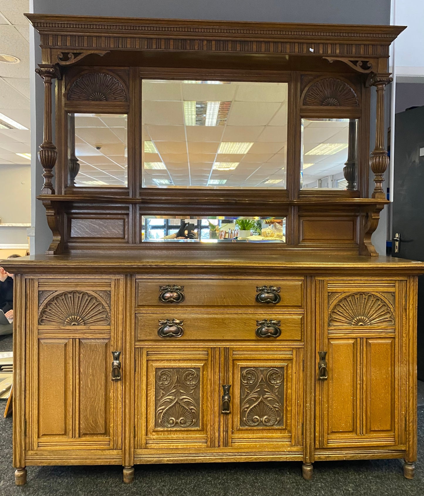 A large 19th century oak and mirror back dresser. Produced by John Taylor & Son of Edinburgh