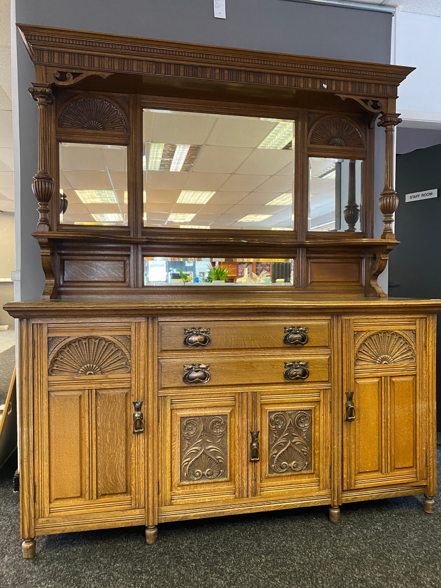 A large 19th century oak and mirror back dresser. Produced by John Taylor & Son of Edinburgh