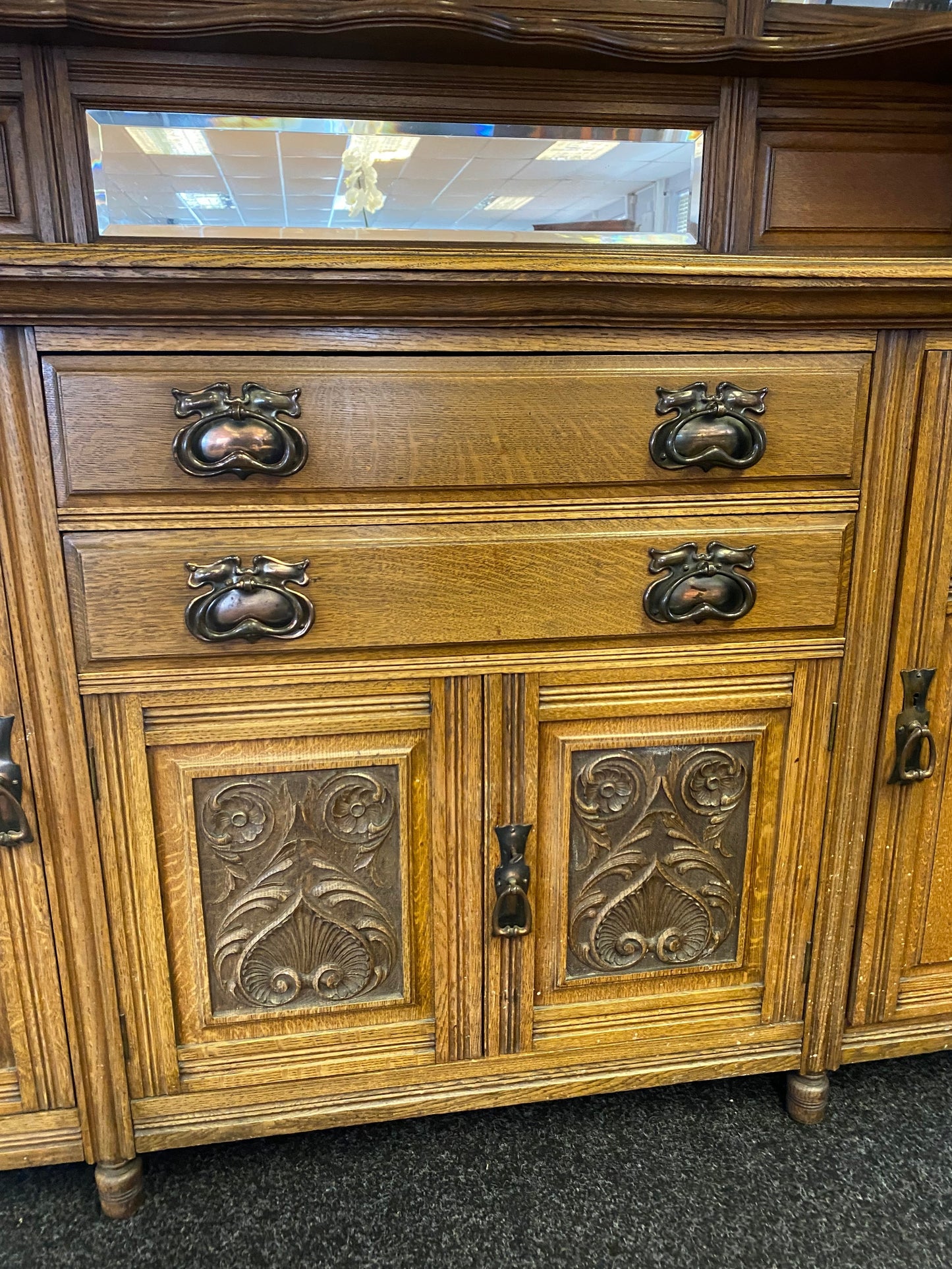 A large 19th century oak and mirror back dresser. Produced by John Taylor & Son of Edinburgh