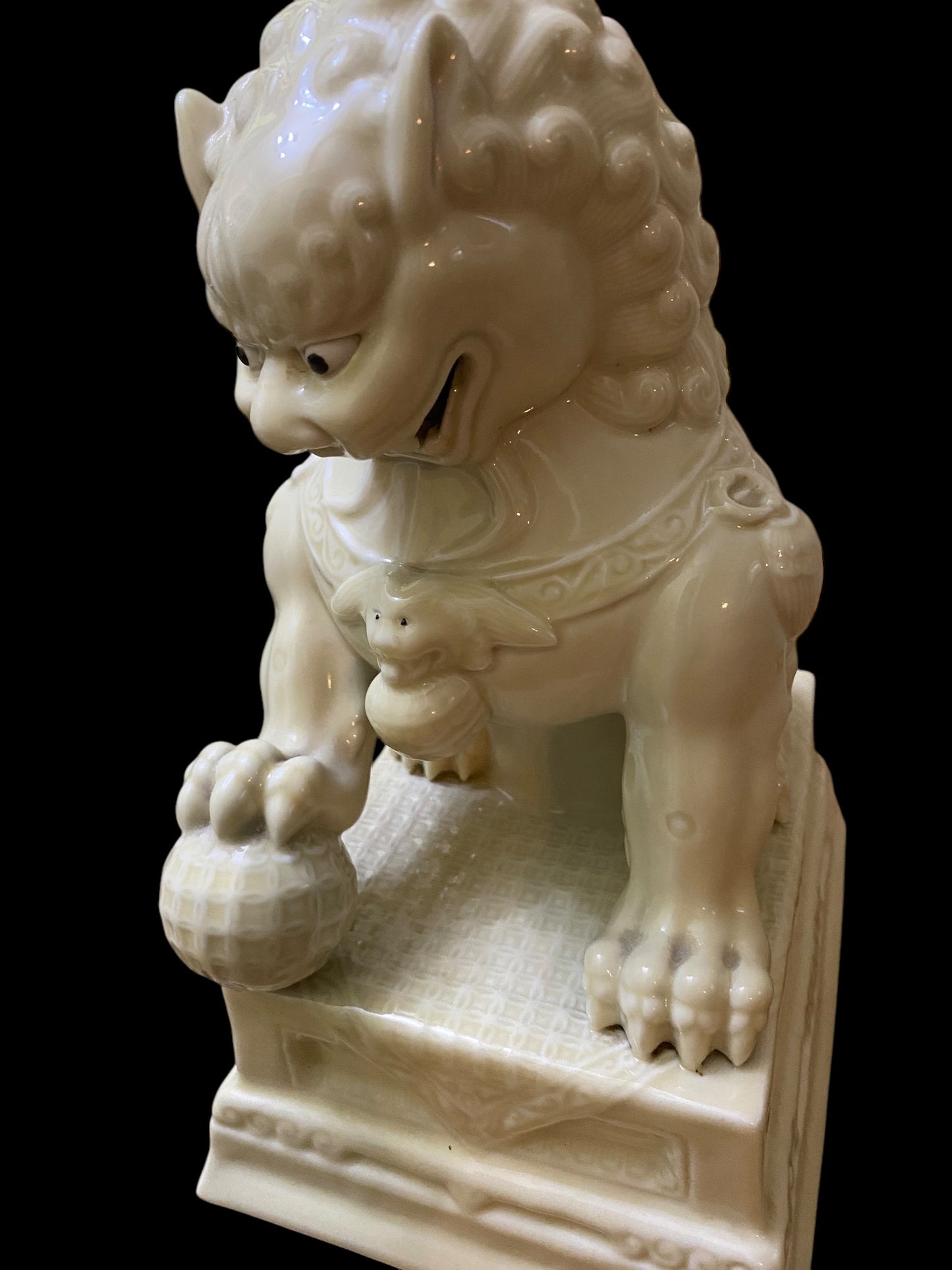 A pair of Chinese Dehua white porcelain Guardian Foo Dog statues