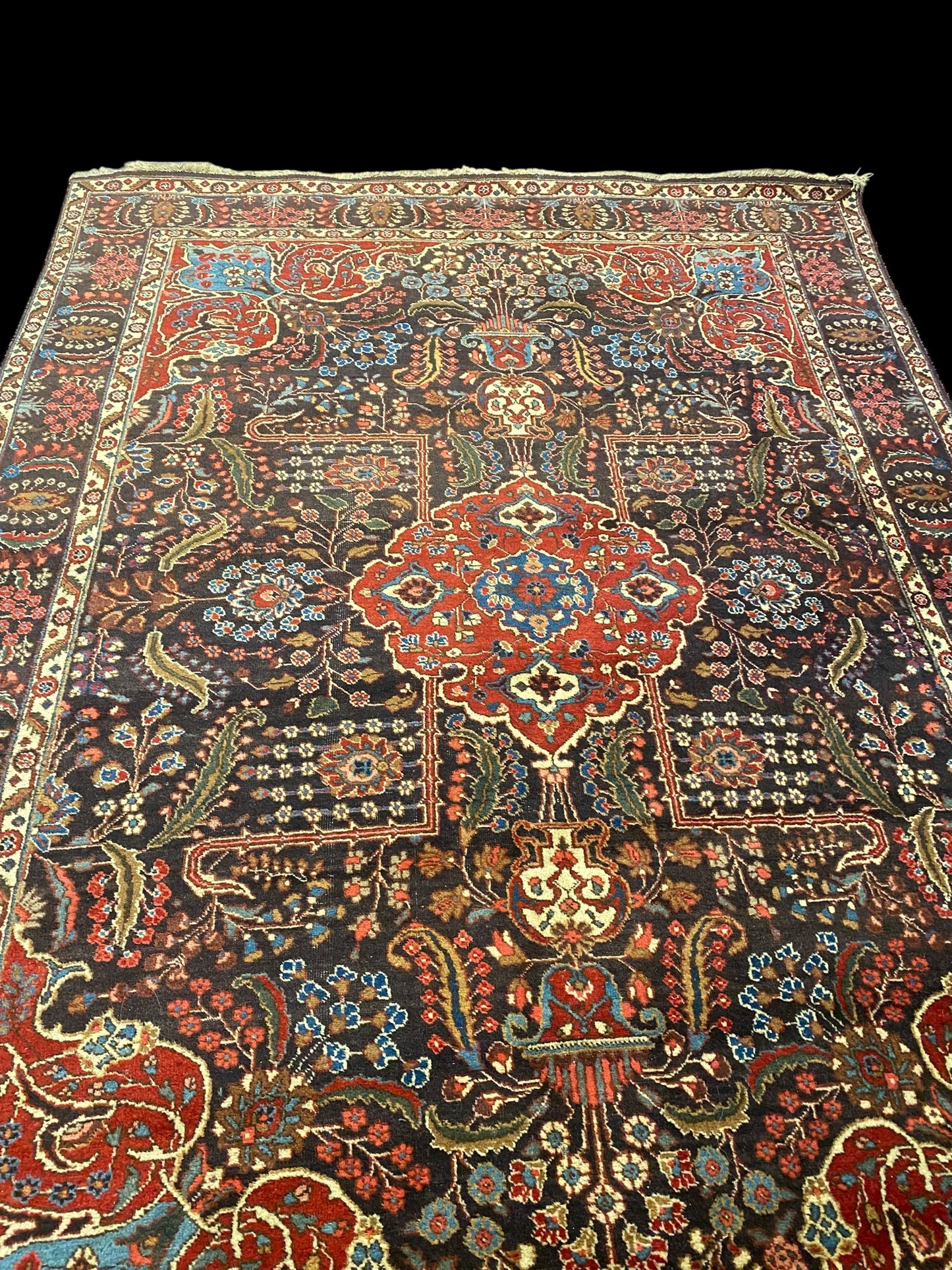 Antique Persian hand tied wool carpet on red and blue ground