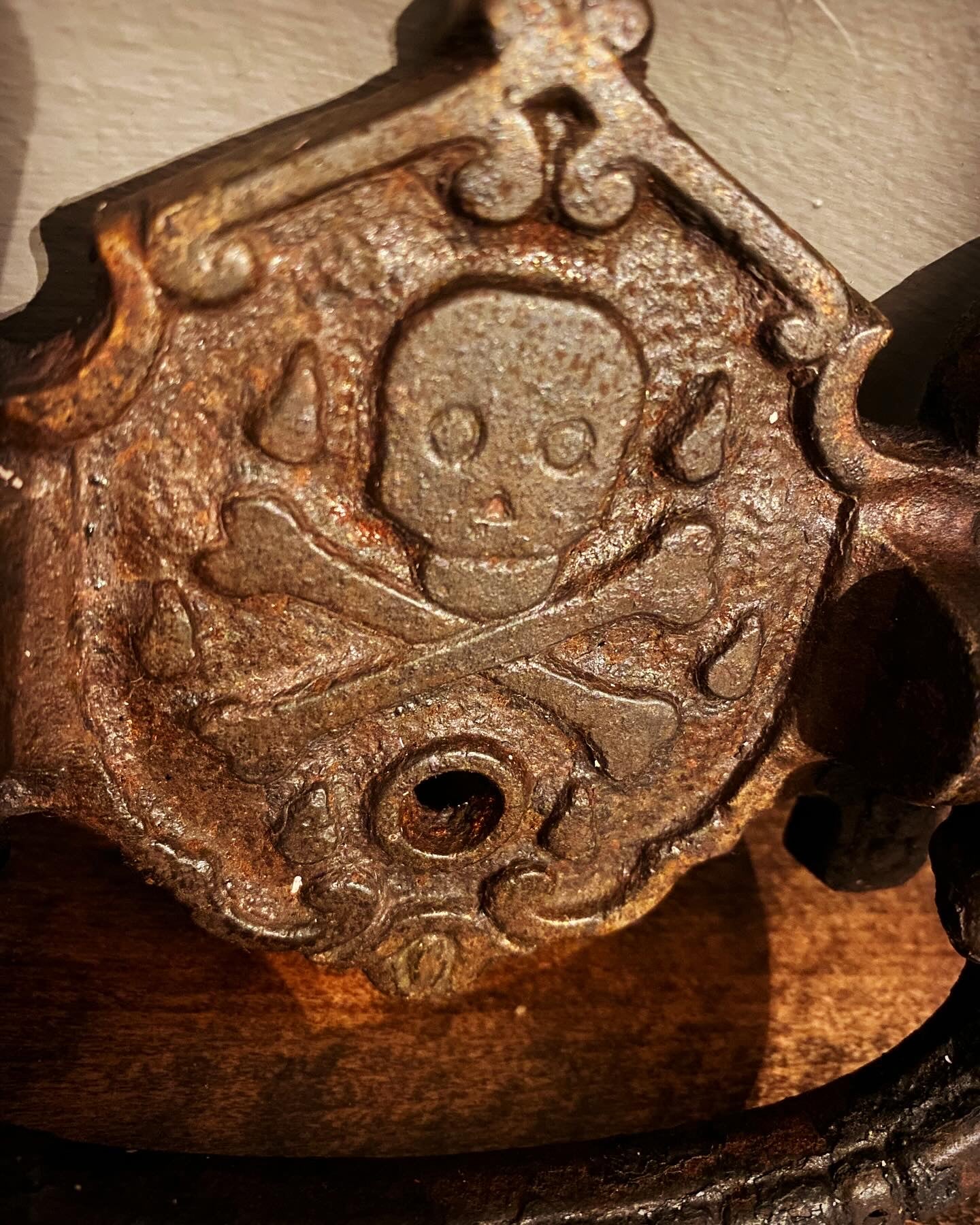 A early 19th century cast iron momento mori  coffin handle