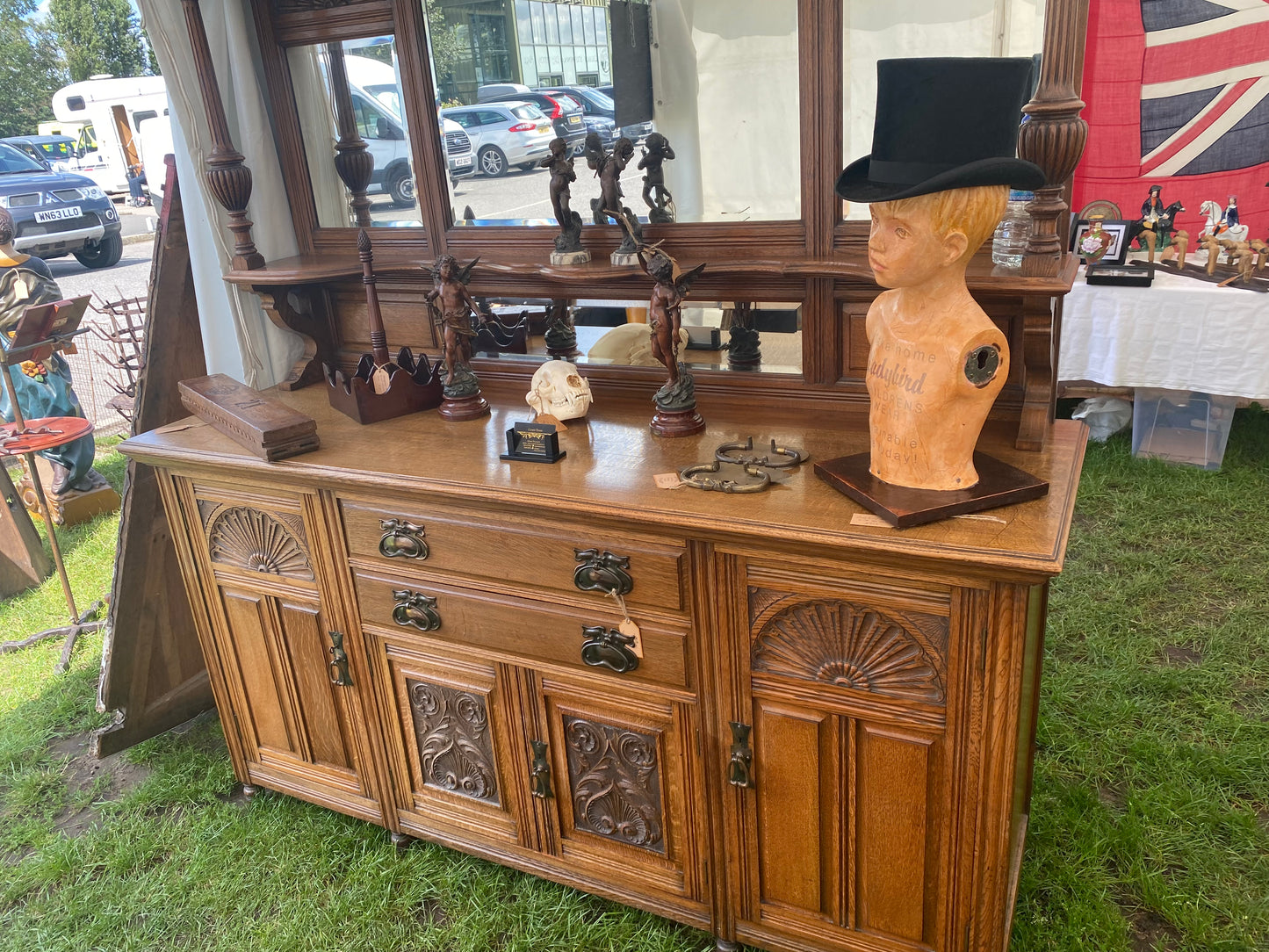 A large 19th century oak and mirror back dresser. Produced by John Taylor & Son of Edinburgh