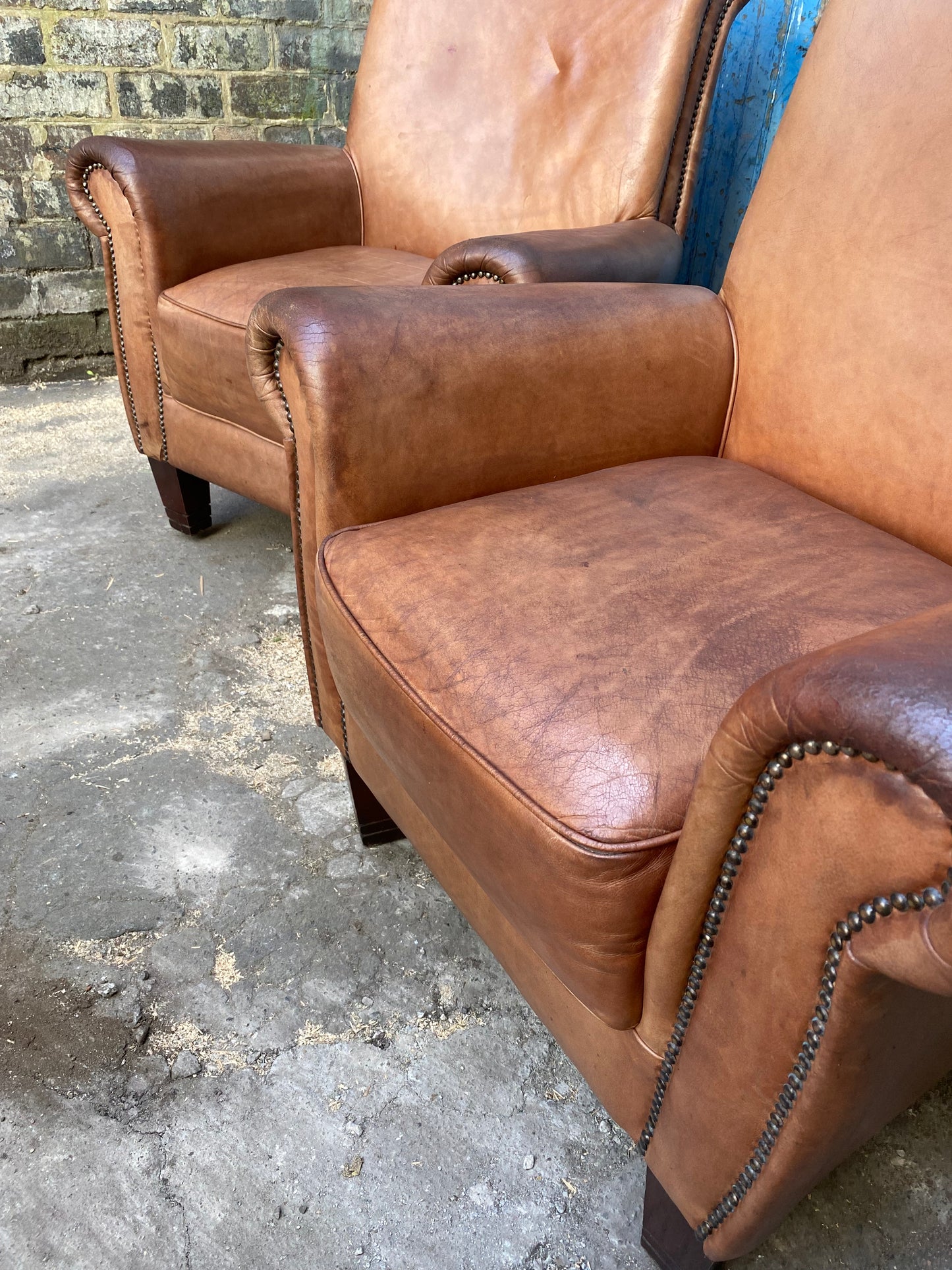 Pair of vintage tan leather armchairs (selling individually or as a pair)