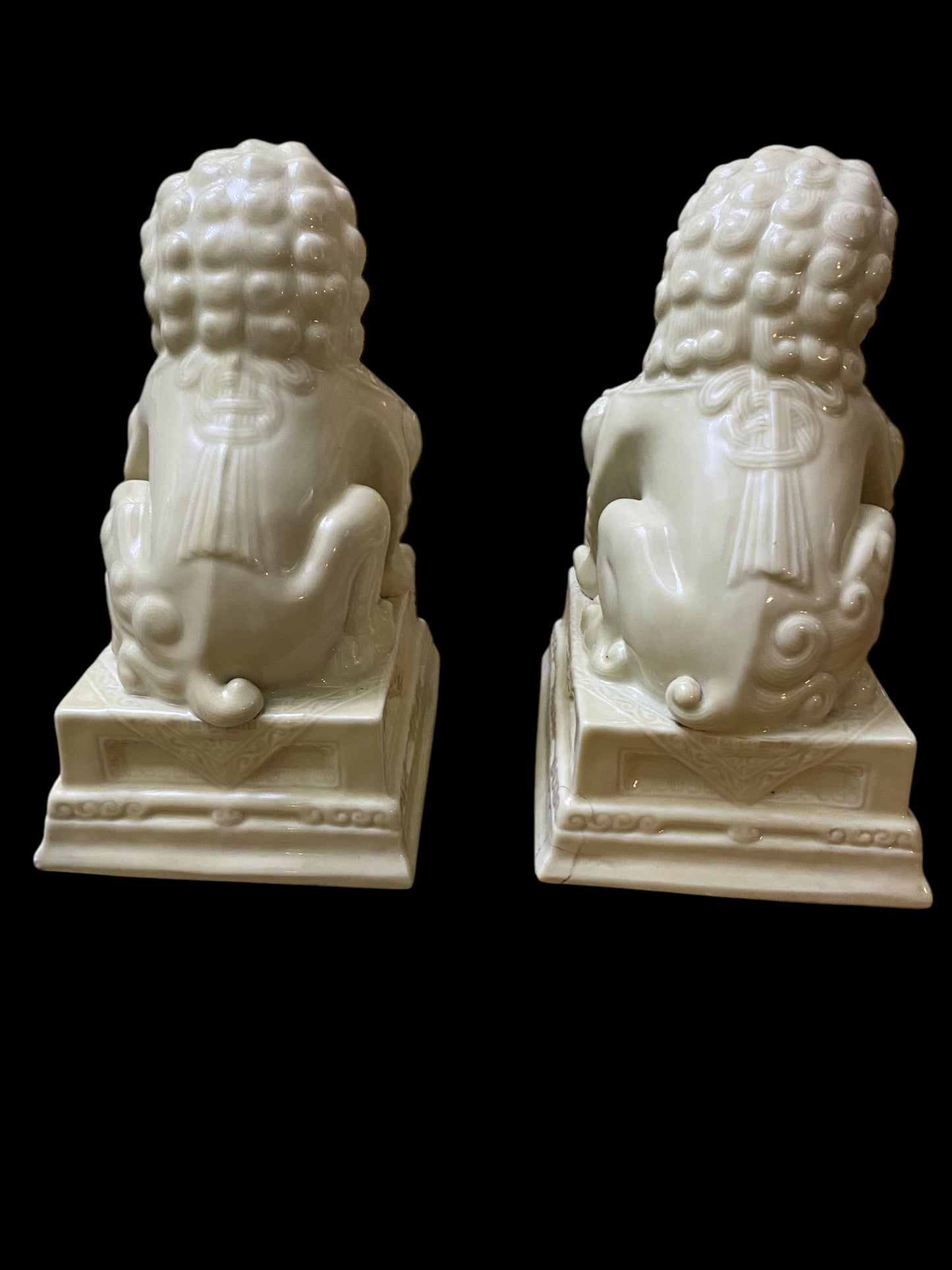 A pair of Chinese Dehua white porcelain Guardian Foo Dog statues