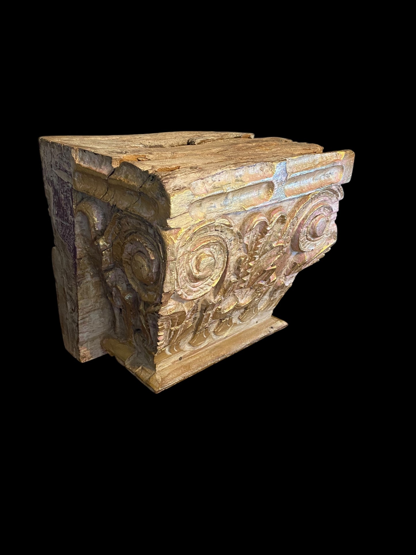 An antique oak corinthian column capital