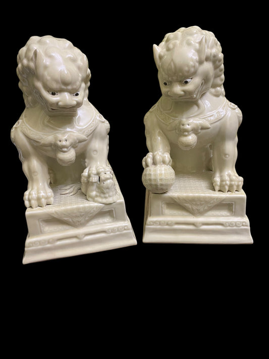 A pair of Chinese Dehua white porcelain Guardian Foo Dog statues