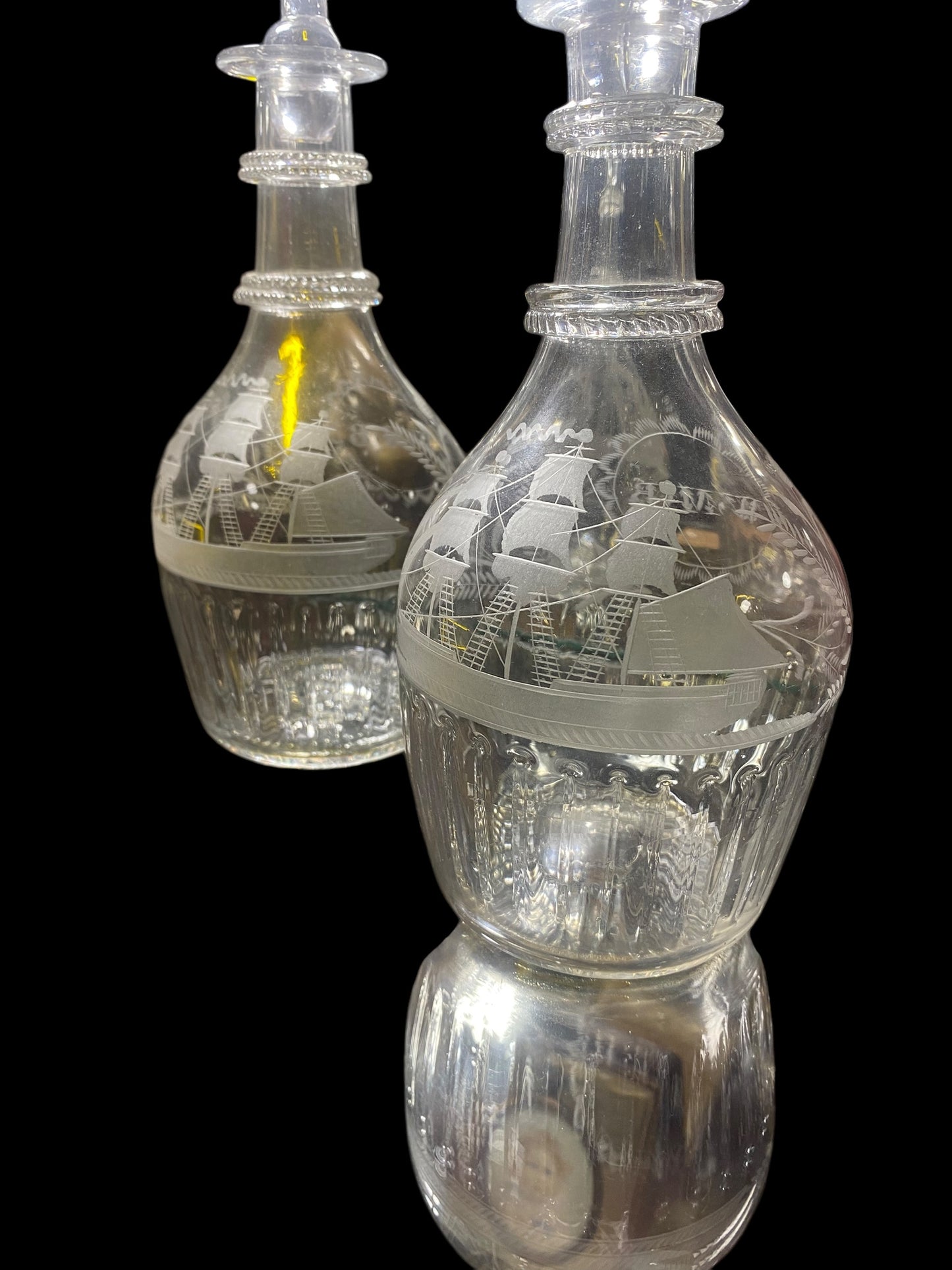 A rare pair of Scottish George III engraved glass decanters