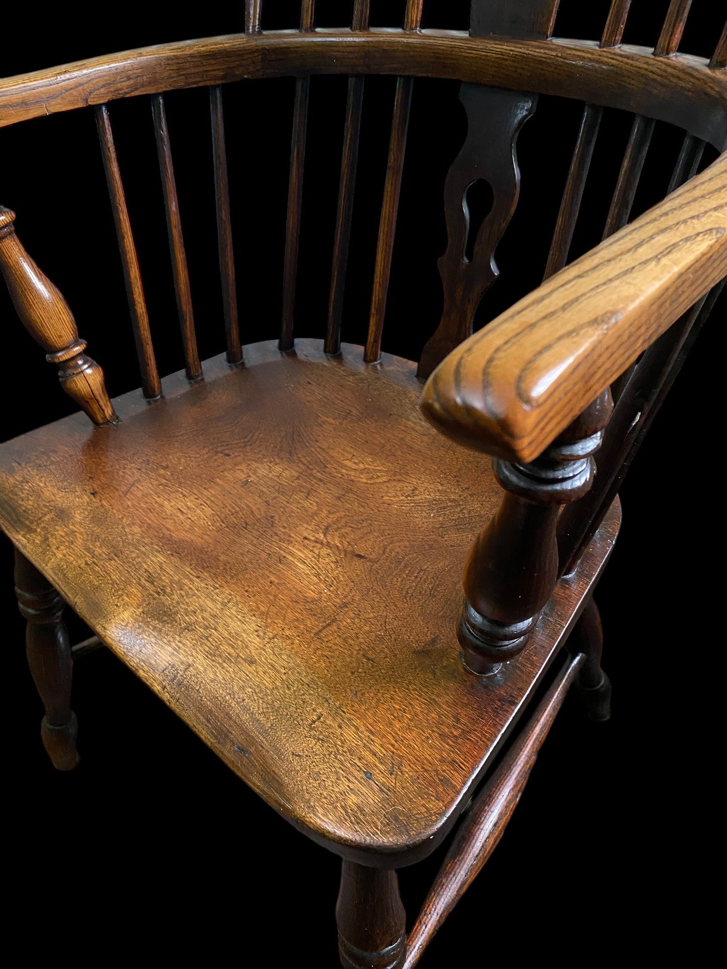 An early Victorian Ash & Elm comb back Windsor chair with carved splat