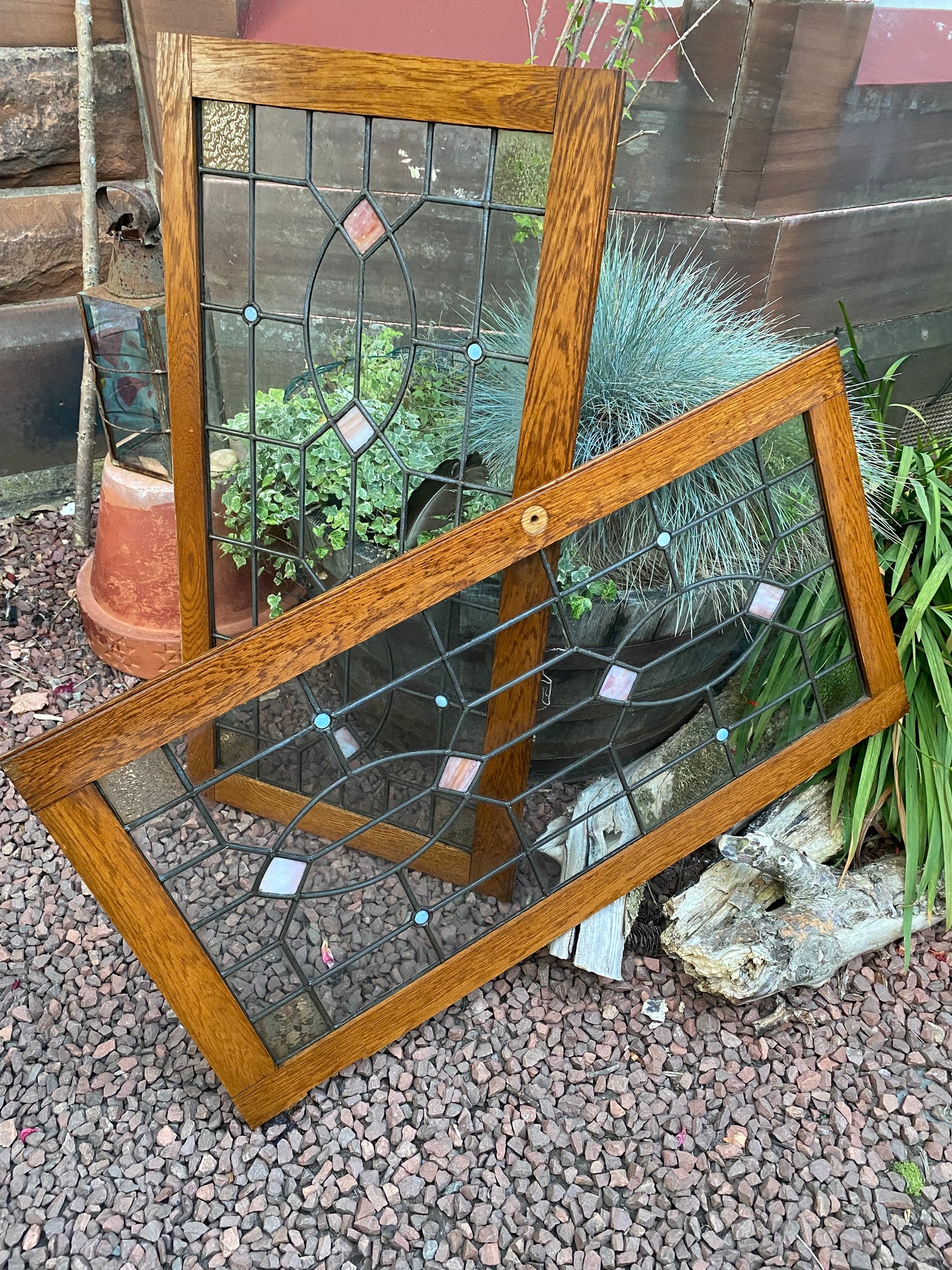 A pair of oak framed leaded stained glass panels circa 1900’s