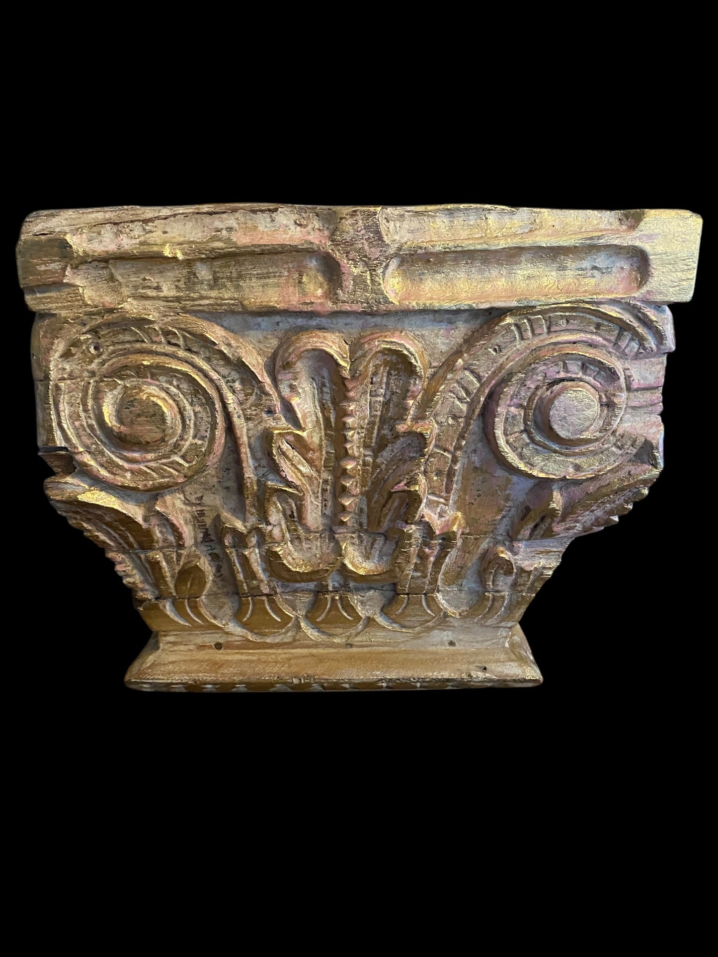 An antique oak corinthian column capital