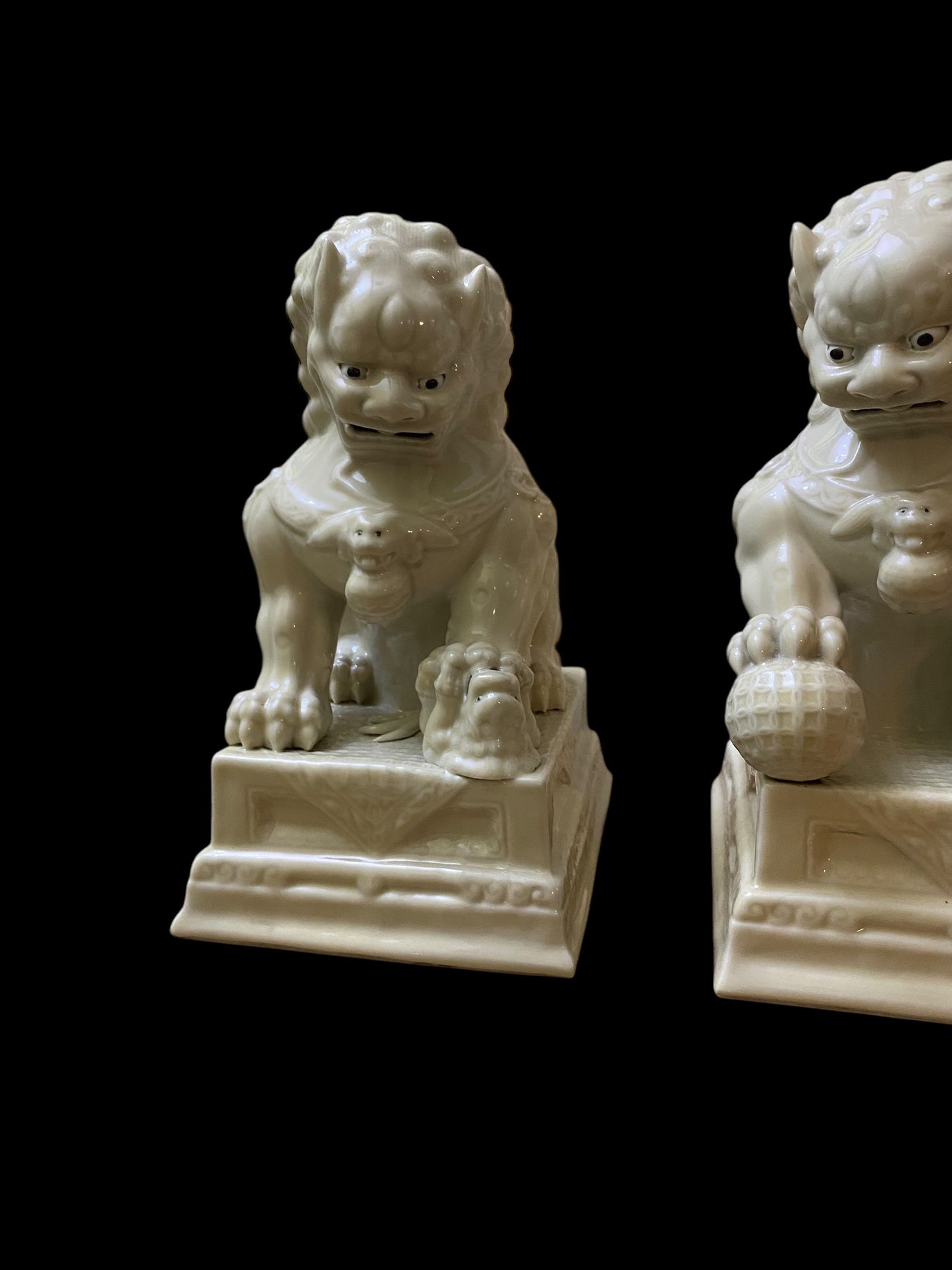 A pair of Chinese Dehua white porcelain Guardian Foo Dog statues