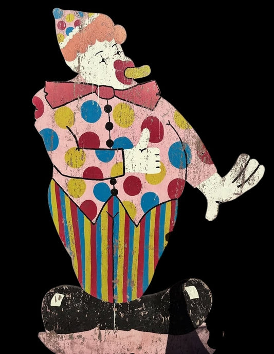 A large hand-painted vintage fairground clown