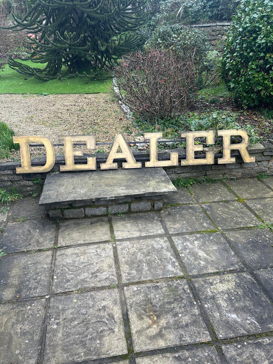 Large former shopfront DEALER sign