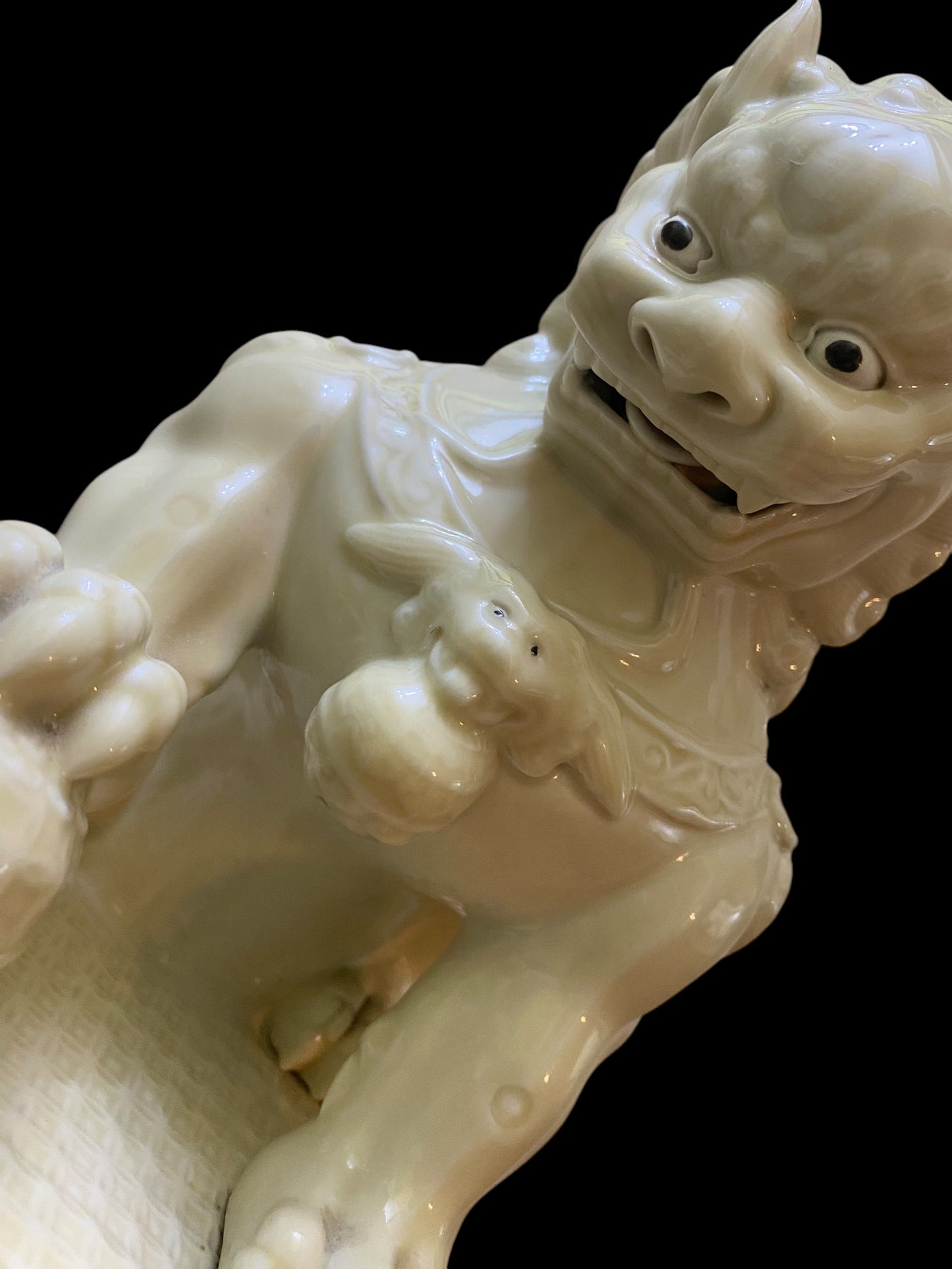 A pair of Chinese Dehua white porcelain Guardian Foo Dog statues