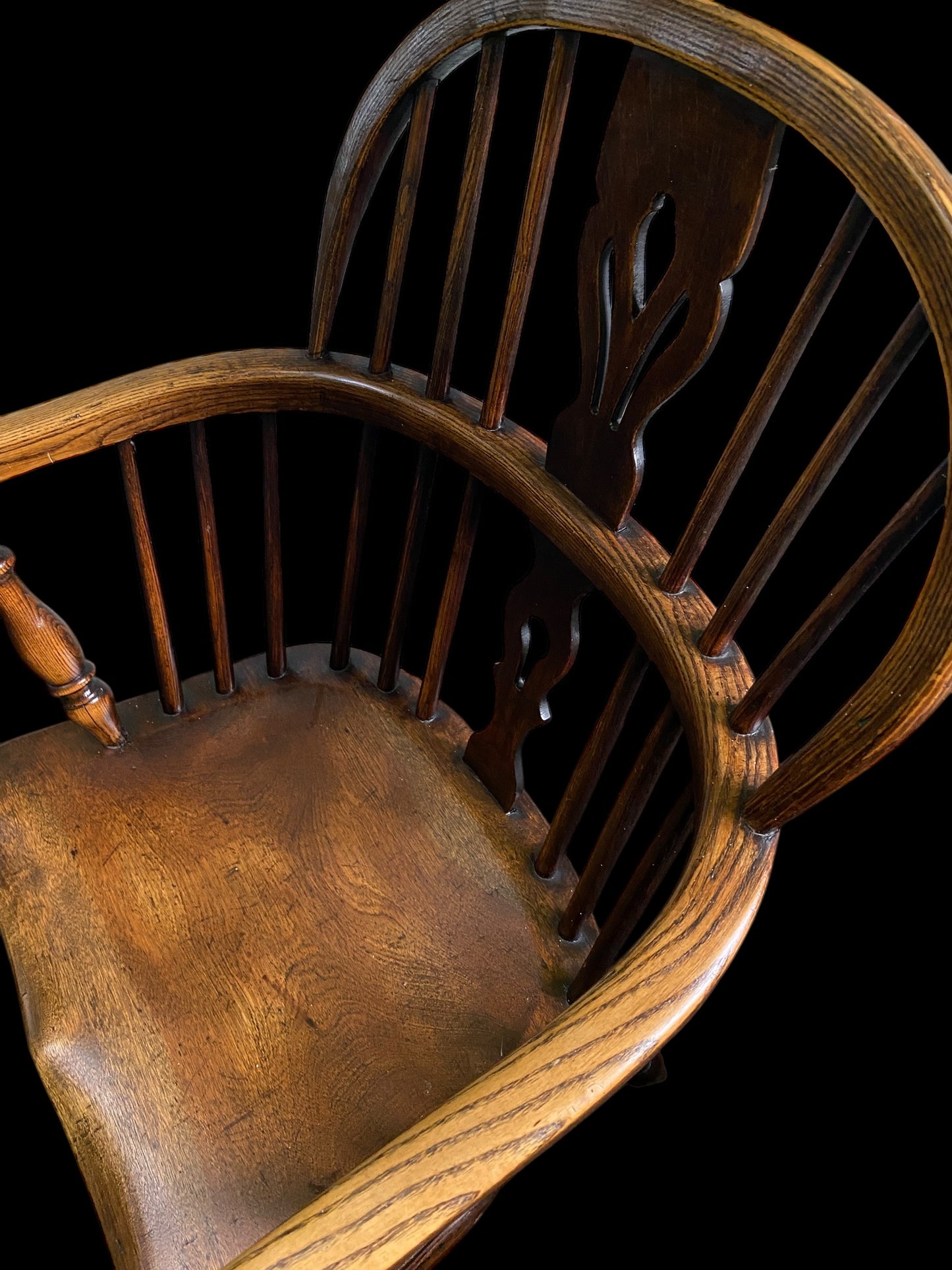 An early Victorian Ash & Elm comb back Windsor chair with carved splat
