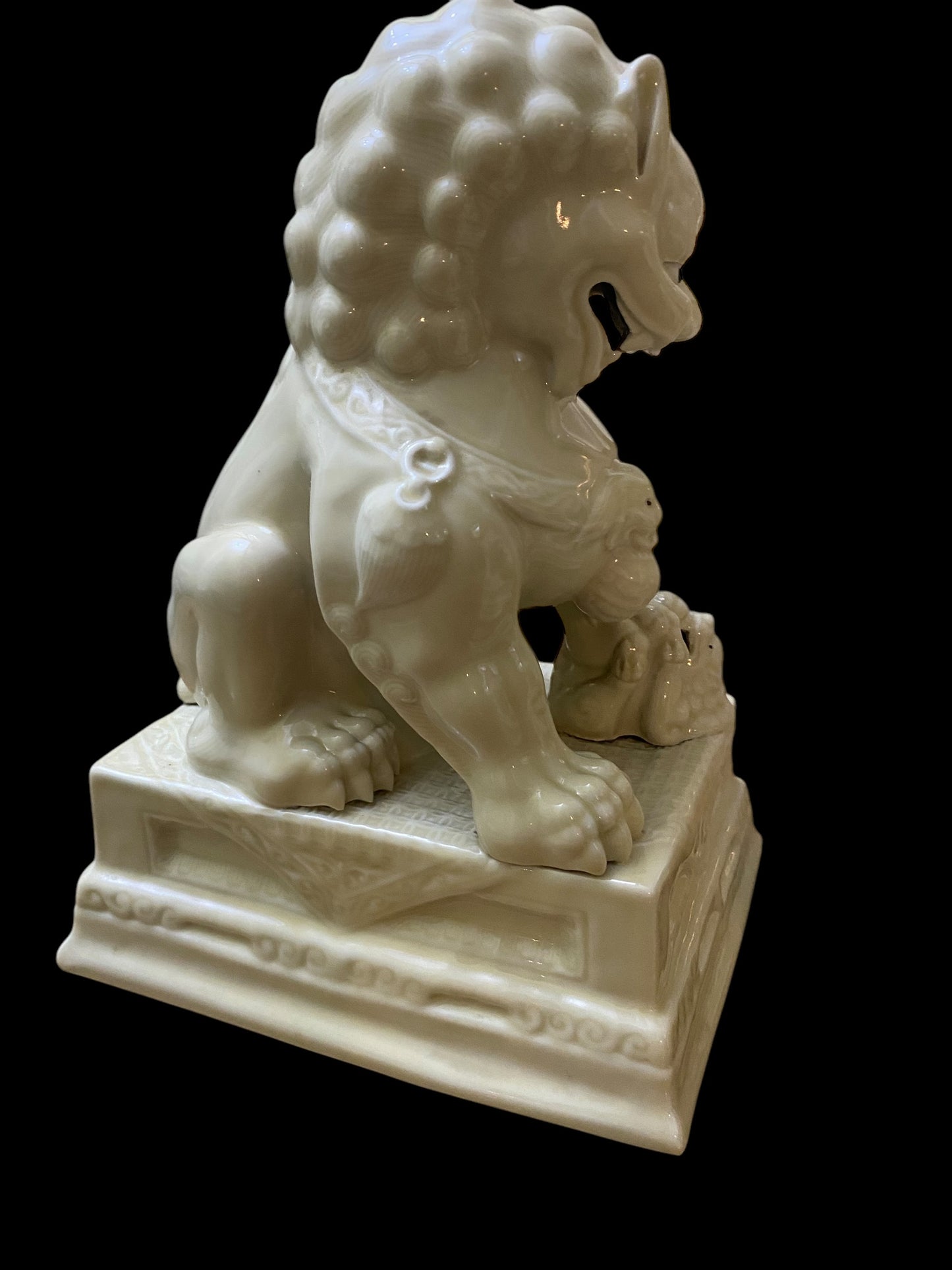 A pair of Chinese Dehua white porcelain Guardian Foo Dog statues