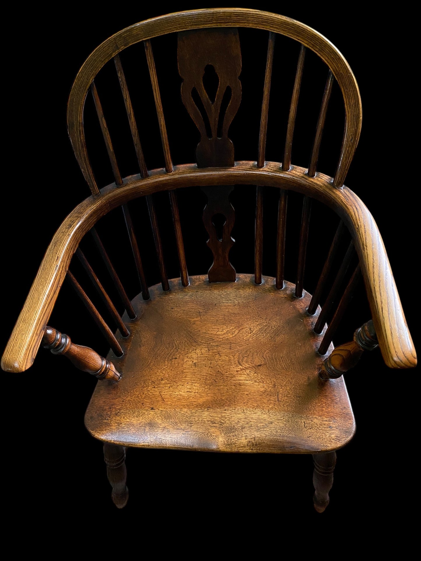 An early Victorian Ash & Elm comb back Windsor chair with carved splat