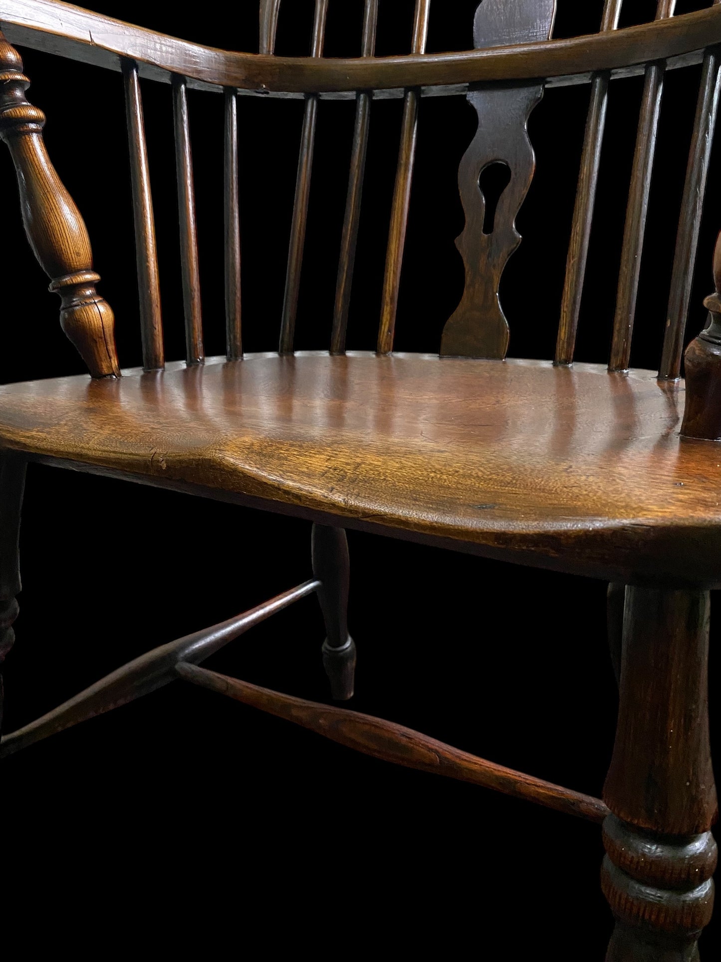 An early Victorian Ash & Elm comb back Windsor chair with carved splat
