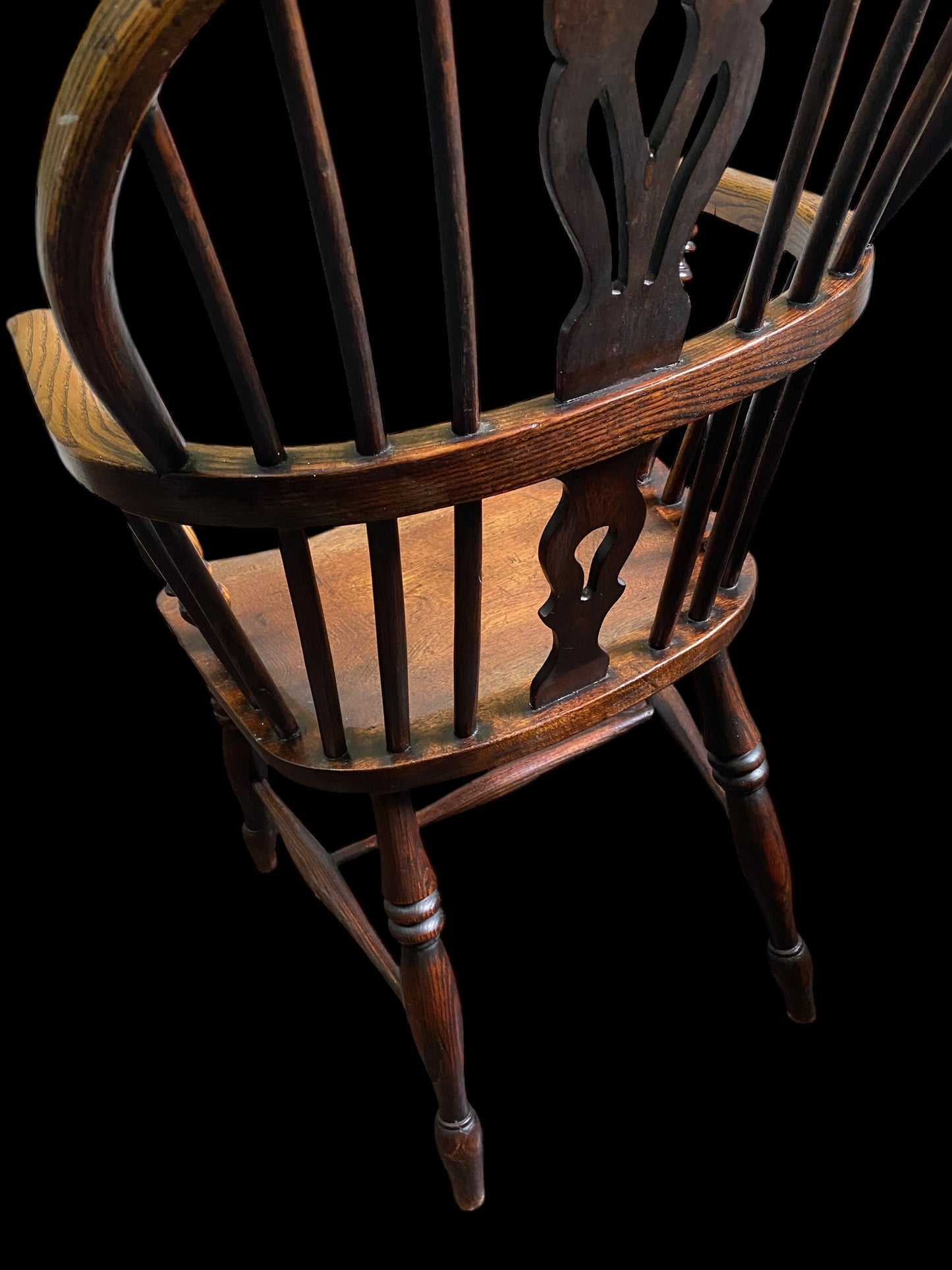 An early Victorian Ash & Elm comb back Windsor chair with carved splat