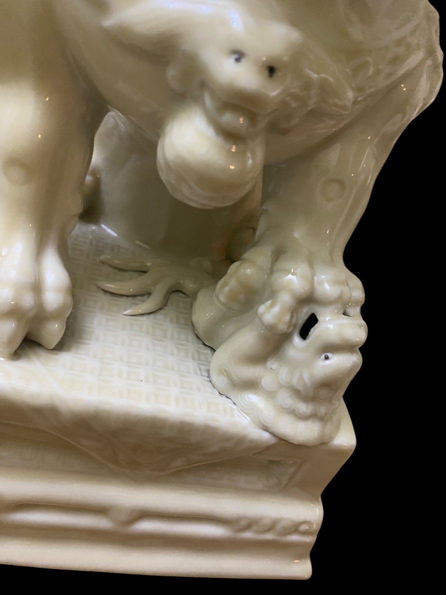 A pair of Chinese Dehua white porcelain Guardian Foo Dog statues