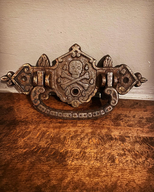 A early 19th century cast iron momento mori  coffin handle