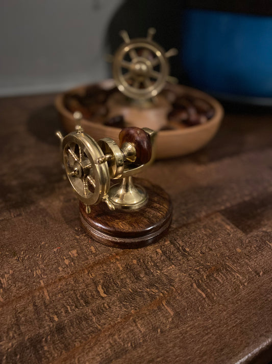 Nautical ship’s wheel nutcracker on small mahogany base